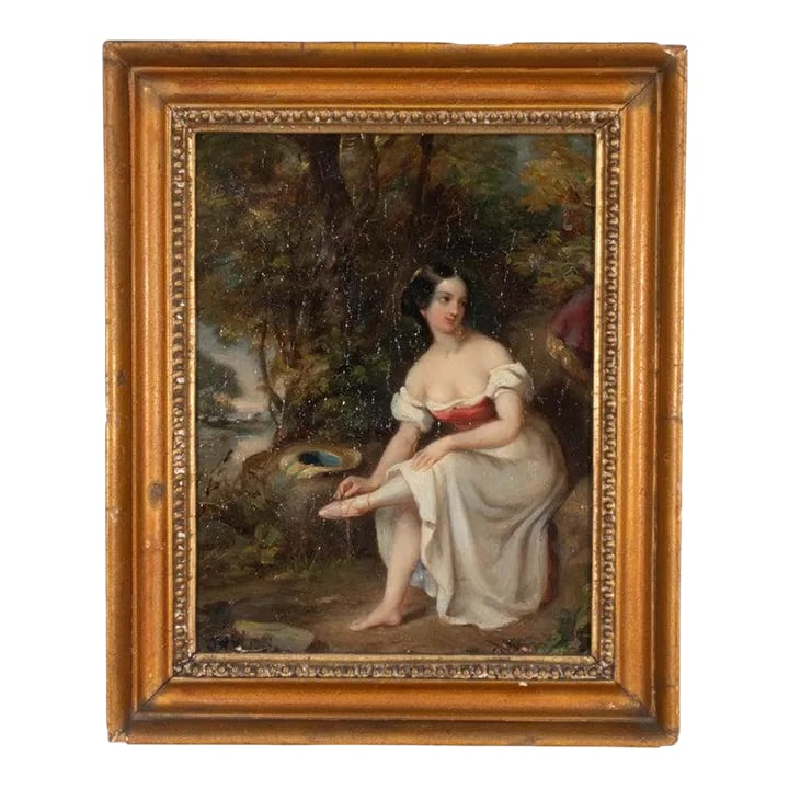 Early 19th Century European Oil on Board Portrait of a Woman With Tired Feet: This charming oil on mahogany board depicts a portrait of a young woman in typical early 19th-century fashion surrounded by foliage while she sits on a rock tending to her shoe. Housed in a giltwood