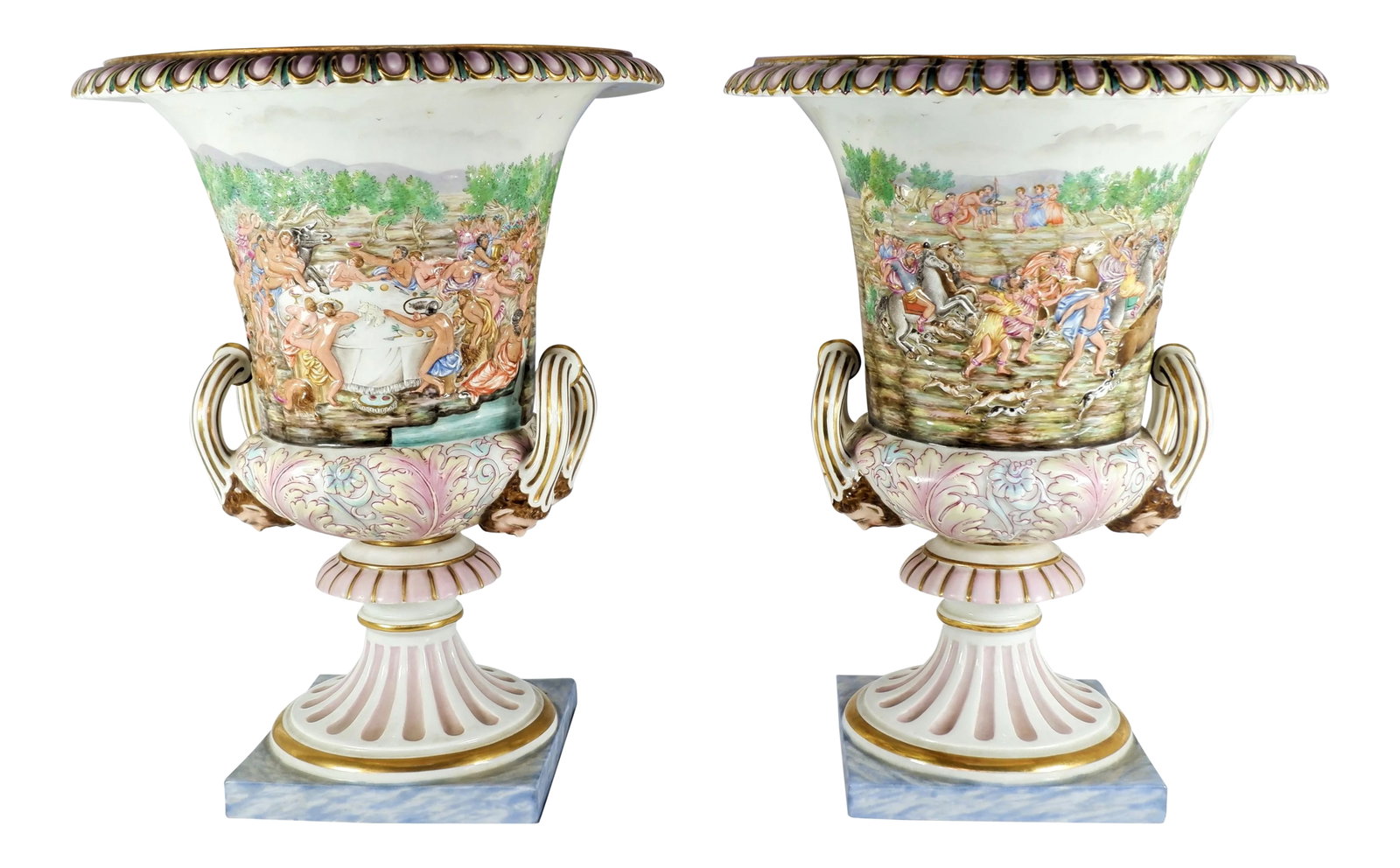 Mid 19th Century Antique Ginori Capodimonte Urns - a Pair: An antique pair of 19th century Ginori Capodimonte urns. Reliefs on the side depict nude and clothed people dancing and eating. There is also a snake and half beast man. At the bottom of side handles 