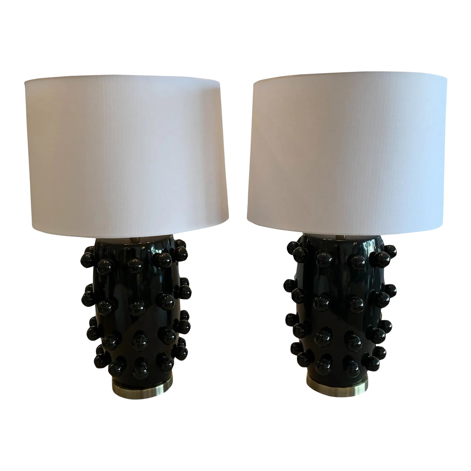 Pair of Marni Table Lamps: This table lamp stands out as a bold piece of dcor just by its design. Crafted from a combination of white gloss and brass metal finishes, the ceramic body is beaded with a ball pattern to add