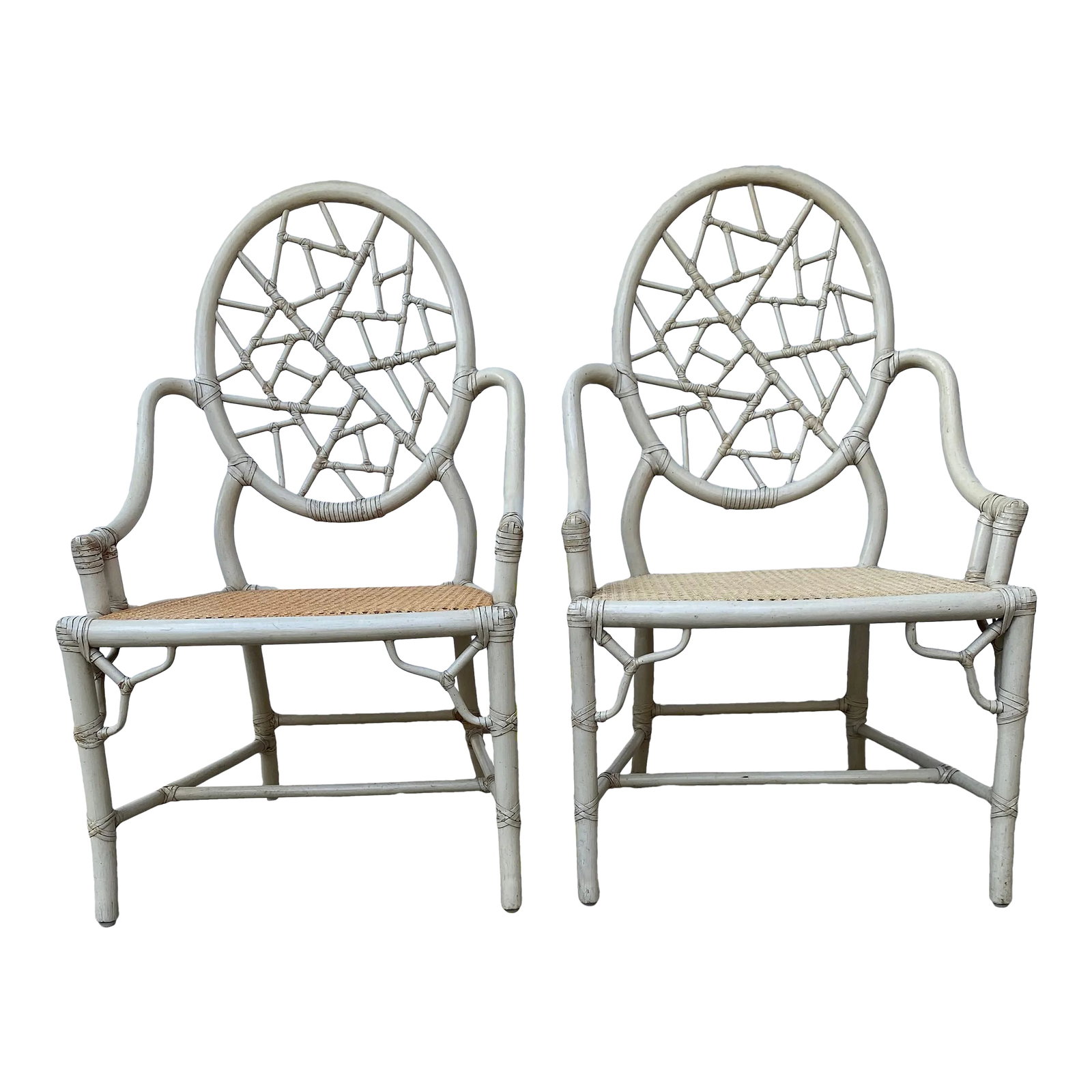 Late 20th Century McGuire Cracked Ice Rattan & Cane Chairs- a Pair: Lovely pair of late Mid-Century, McGuire handcrafted Iconic "Cracked Ice" rattan chairs with cane seats, designed by Elinoe McGuire. These chairs are made of sturdy rattan, with leather cowhide bindin