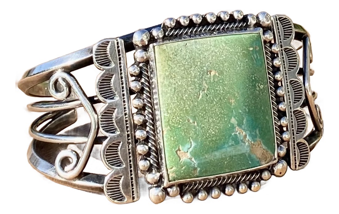 Navajo Sterling + Turquoise Cuff Bracelet: Beautiful, large and in excellent original condition, circa 1940's-50's. Sterling silver with large polished natural green turquoise square gemstone. This wide gorgeous statement Navajo cuff is easy