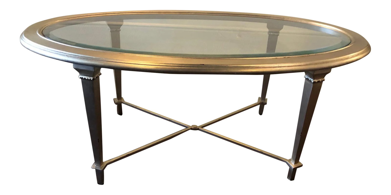 Hickory Chair Oval Silver Leaf Coffee Table: This oval cocktail table features a beveled glass top and distressed silver leaf finish. Dimensions 46"w x 24"d x 19"h Condition: Imperfections: No Imperfections Condition Notes: Great, new