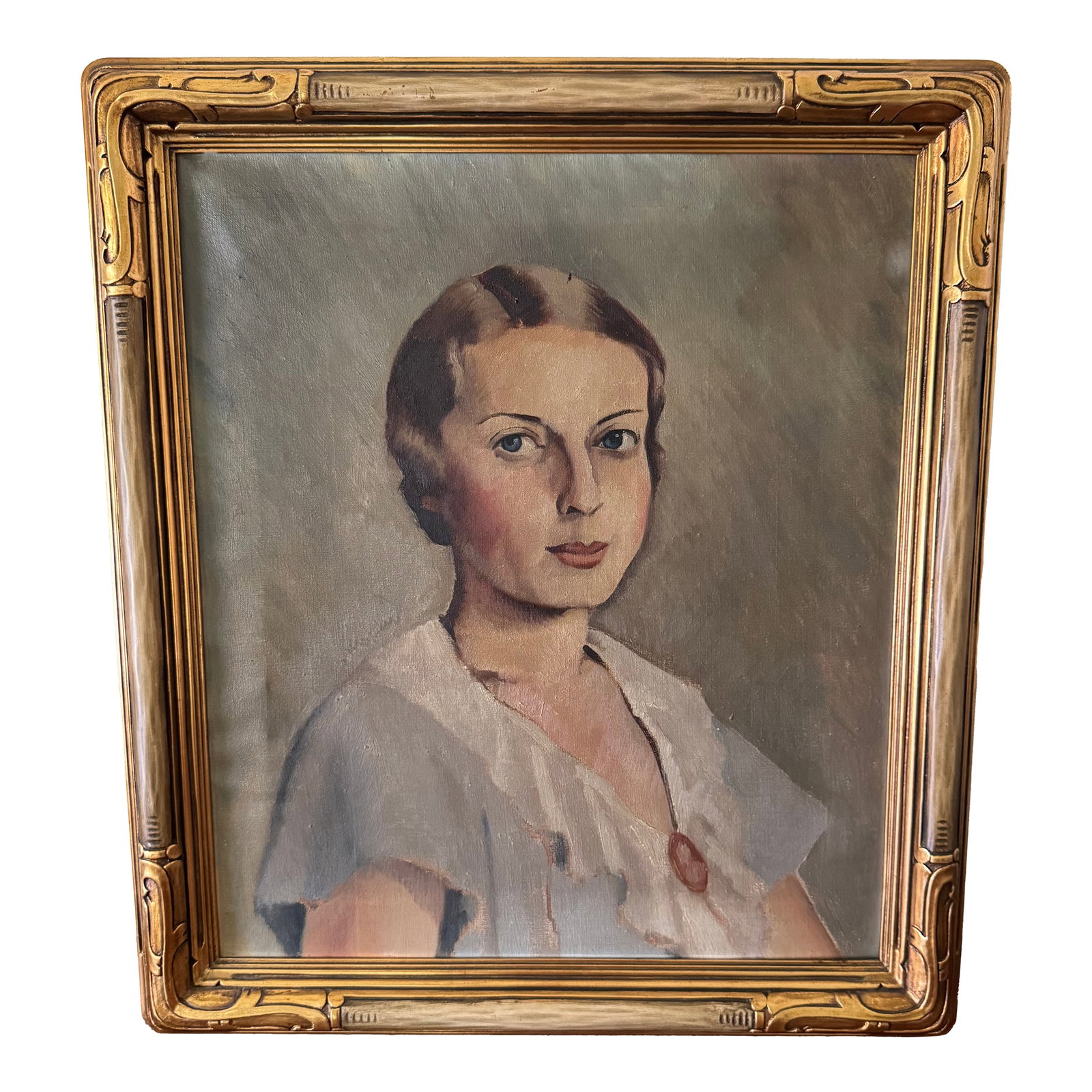 1930's Art Deco Portrait Painting of a Woman, Framed: Stunning, 1930's Art Deco portrait painting on canvas of a striking blue eyed woman. Soft muted colors of gray, blue, cream, and browns in an exquisite carved gold gilt wooden Frame. Signed and dated