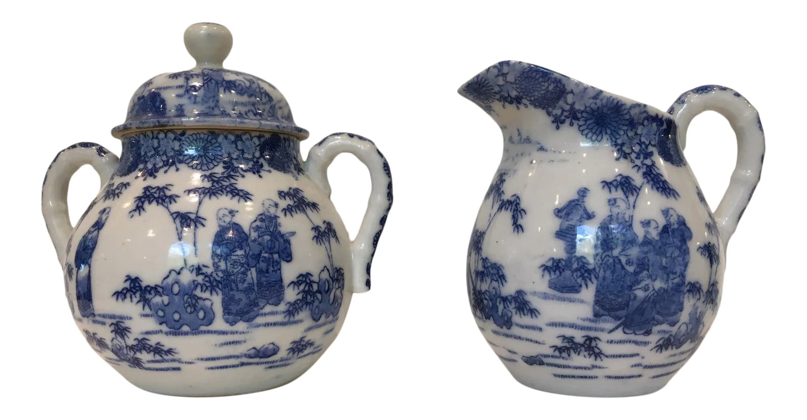 Vintage Chinoiserie Blue and White Creamer and Lidded Sugar Bowl - Set of 2: Charming vintage cream-and-sugar set decorated with intricate blue-and-white Chinese garden scenes. Perfect addition to a cottage table, or to hold small bouquets! Condition: Alterations: Original