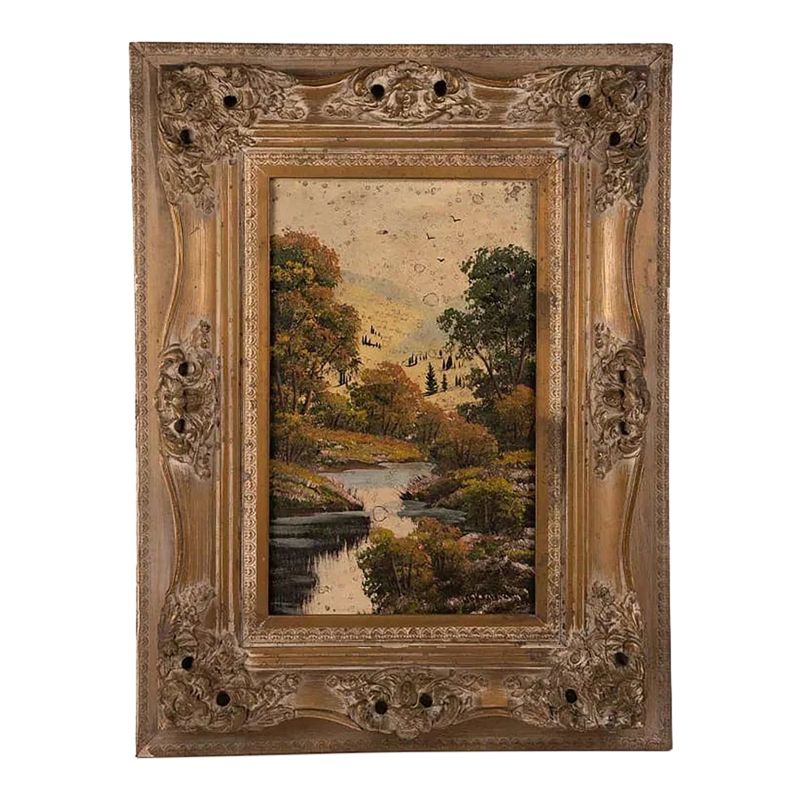 Mid 20th Century Signed Fall Landscape Oil Painting in Ornate Gilt Frame: A richly textured oil on canvas autumn landscape, depicting a peaceful river flanked by trees in vibrant fall color. The brushwork captures the movement of water and the glow of late-season foliage wi