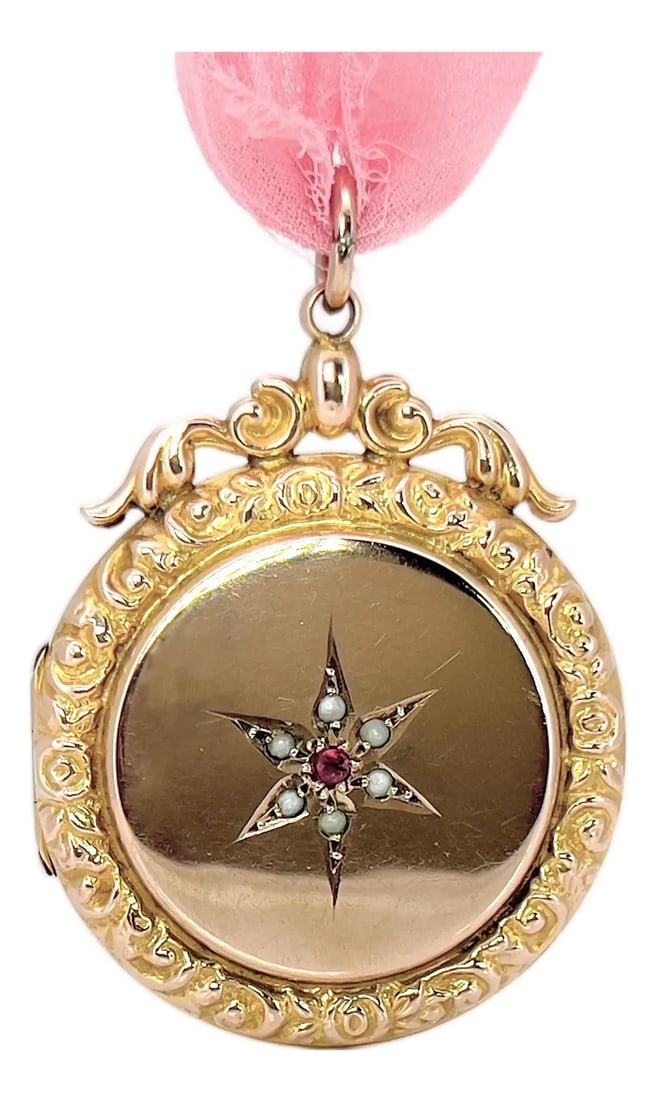 Antique Pearl & Garnet Celestial Star Locket, 9kt Back and Front: About This Locket: This beautiful Antique 9K Back & Front Star Locket features pearls on each star point and a gorgeous garnet center. The intricate repousse work adds a touch of elegance and the