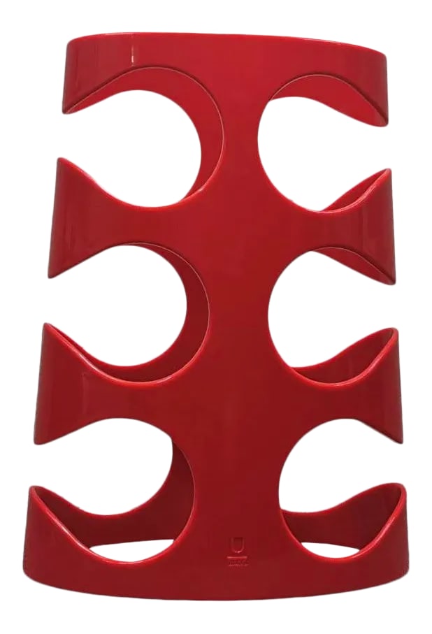 Red Y2k Umbra "Grapevine" Wine Rack: This sculptural piece was designed for Umbra by Ron Lerner in 2010. Made of molded plastic, it becomes its own piece of art even when empty. Also available in Black. Condition: Alterations: Original C