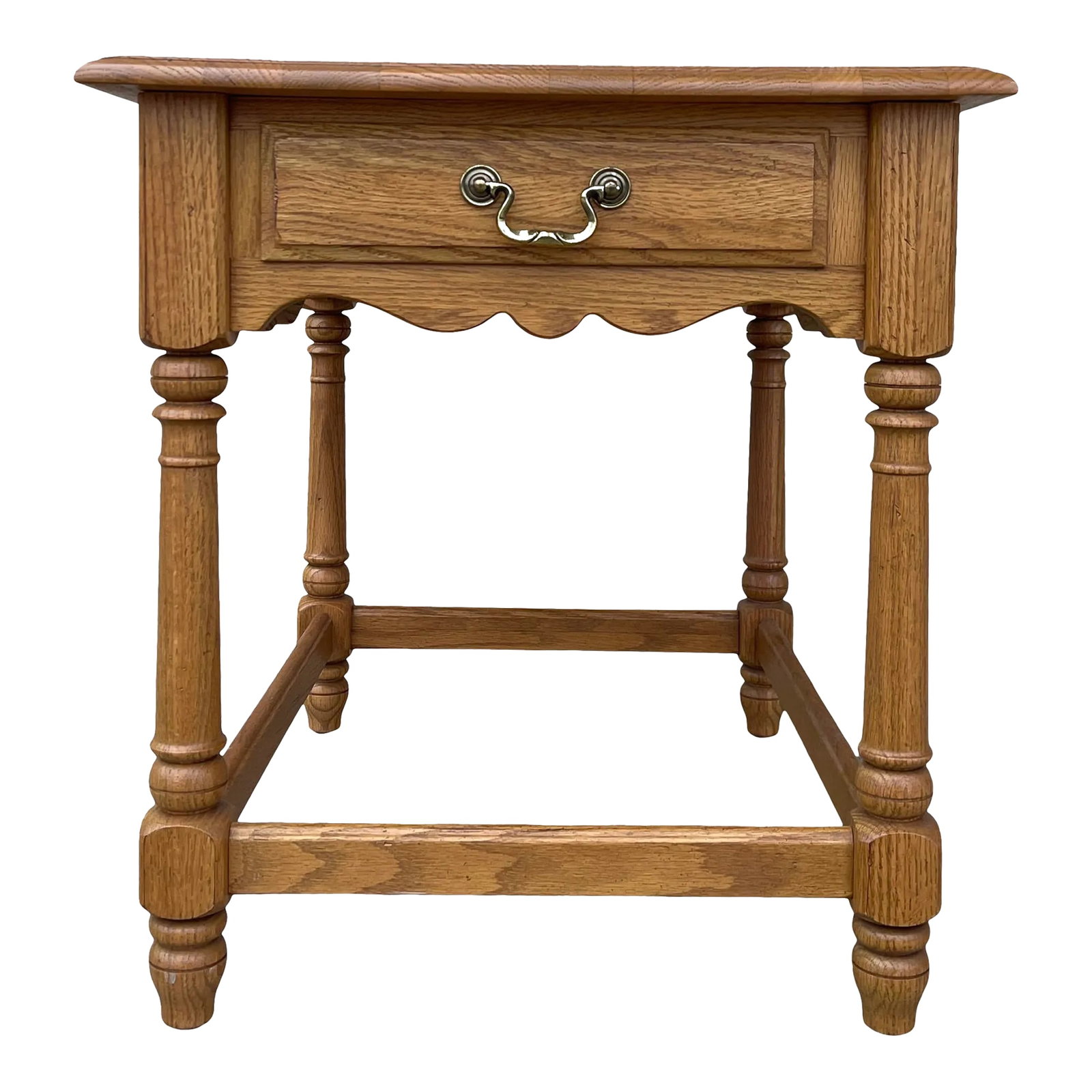 Ethan Allen Canterbury Collection Traditional Oak 1 Drawer Side Table: A late 20th century Ethan Allen Canterbury Oak collection Traditional side table having a single dovetailed drawer over turned legs with stretchers. Circa 1990. Item # 20-0403 Finish # 278 Condition: 
