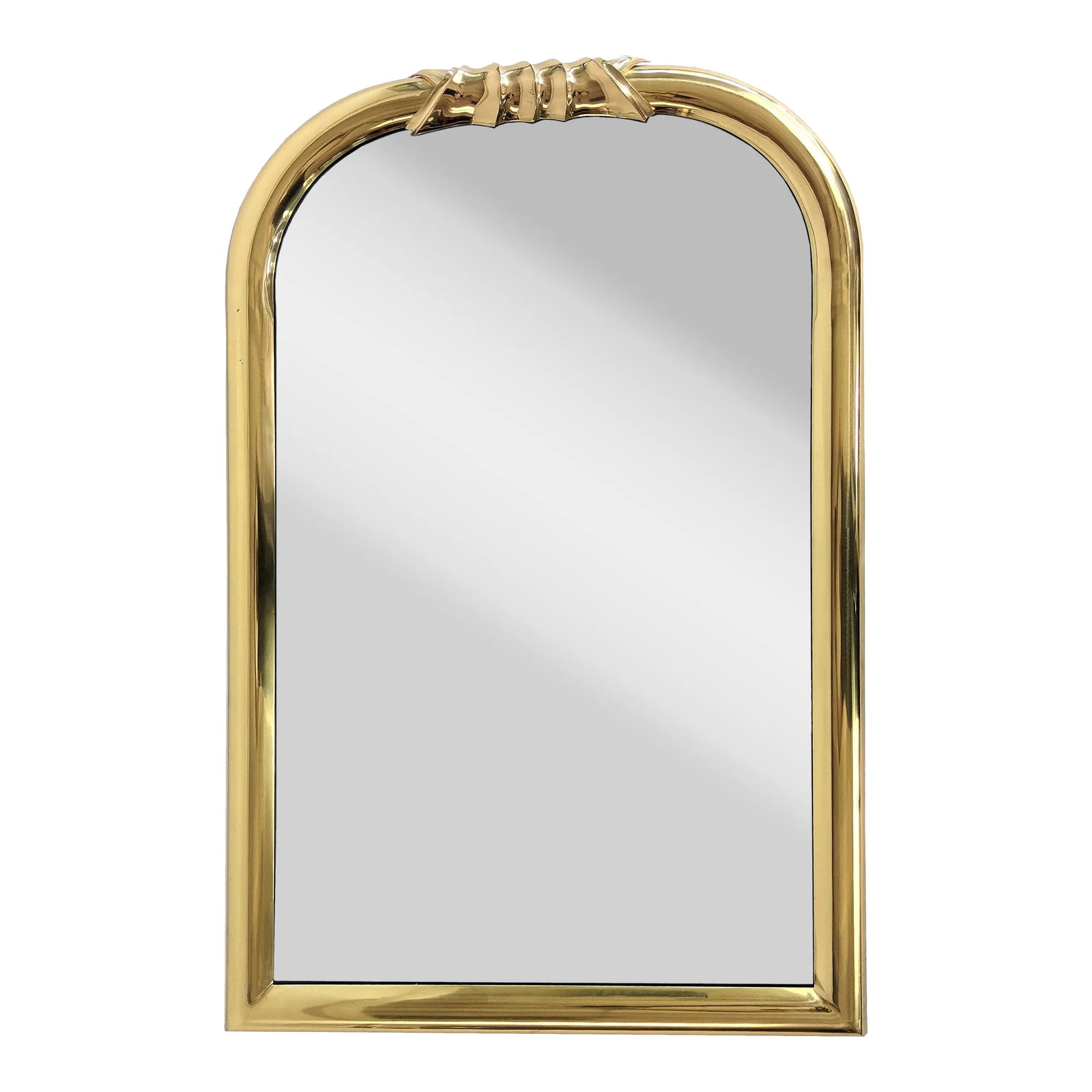 Louis Philippe Style Brass Wall Mirror: 1970's Mid-century Brass Louis Philippe style Wall hanging Mirror with ornament on the top and curved corners. In overall good condition. Some minor spots on frame. Glass in good condition. This