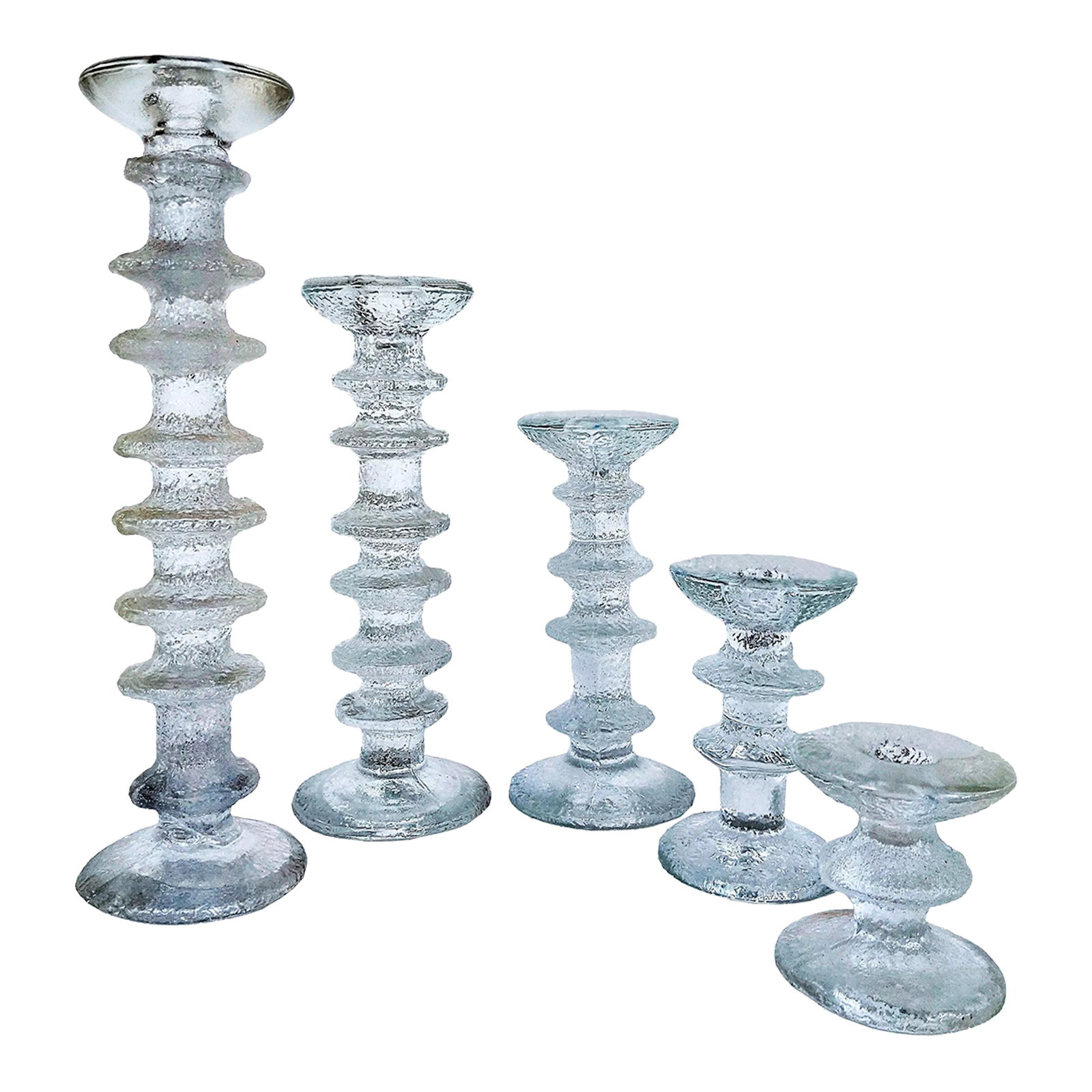 Vintage Timo Sarpaneva for Iittala Set of 5 Glass Candlesticks: Set of 5 Vintage textured clear molded ice glass Candlesticks, composed as a column with projecting bands, a flared mouth and a round base. Designed by Timo Sarpaneva for Iittala, Finland. Gorgeous