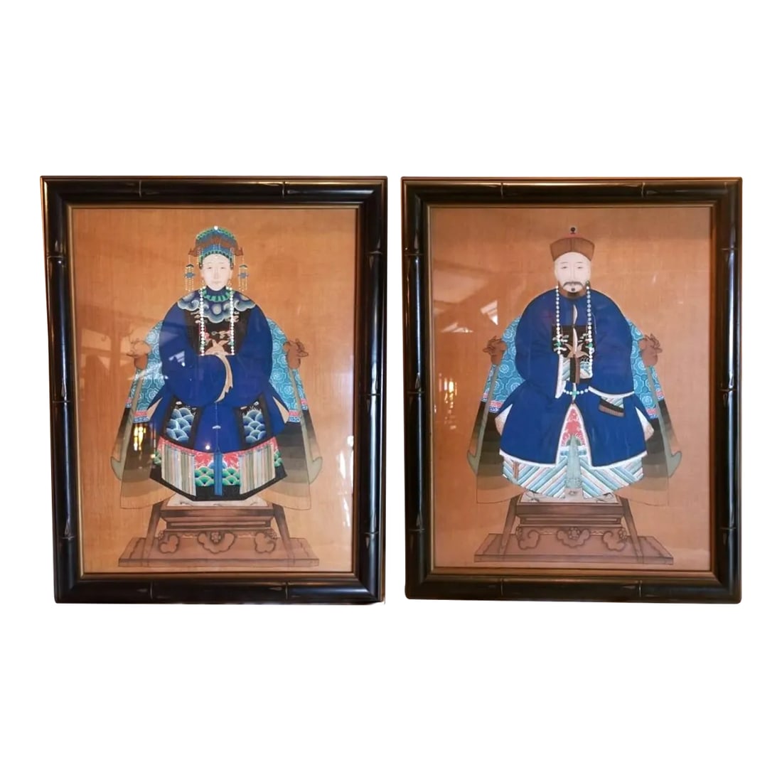 1930s Pair of Chinese Ancestorial Portrait Paintings, Framed: This lovely pair always stick together. We adore their soft smiles and intricate clothes. They add a lot of charm wherever they go and are decently sized for filling space in your gallery wall!