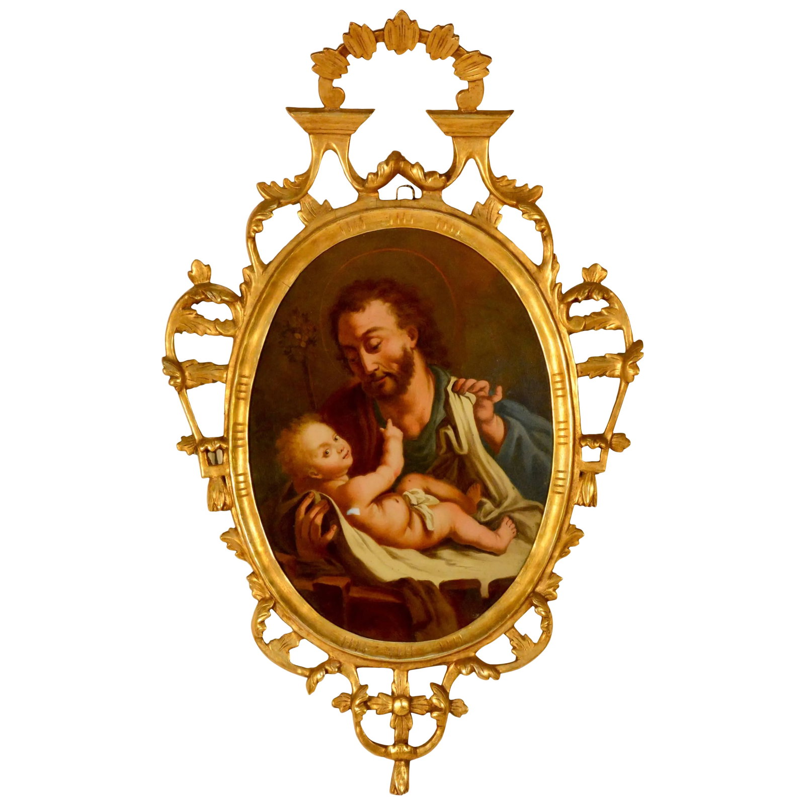 Spanish Religious Reverse Painting Saint Joseph With the Christ Child: This painting is from Northern Spain of a religious reverse painting on glass depicting Saint Joseph with the Christ Child. It is enclosed by an arched, gilded wood and gesso frame and carved with