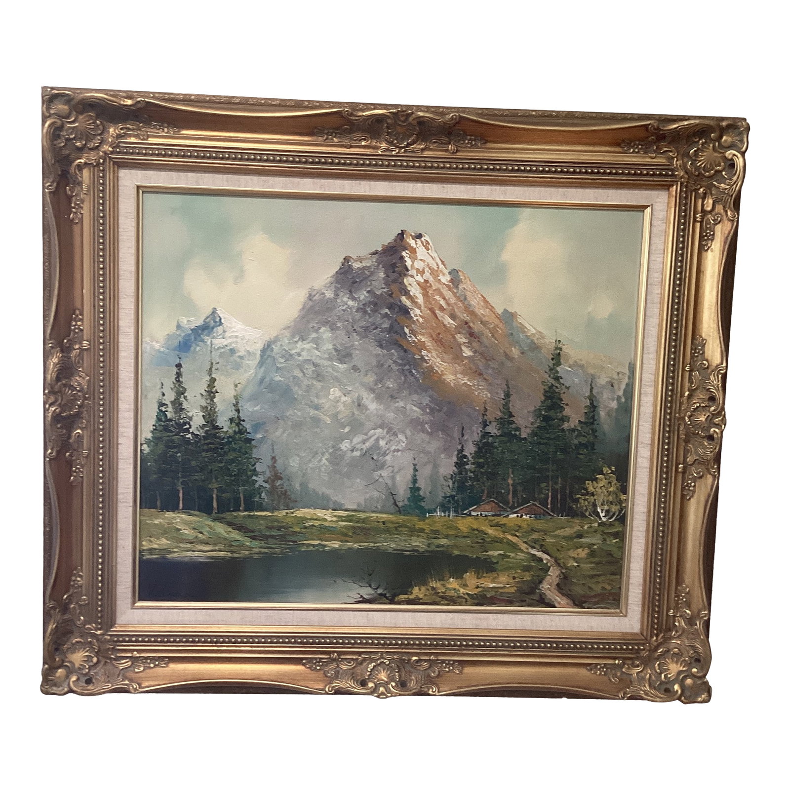 Original Painting of a Mountain Landscape with Lake and Evergreen Trees Signed Framed: This beautiful painting depicts a serene mountain landscape with a tranquil lake and evergreen trees stretching towards the horizon. The artwork is thoughtfully framed, making it ready to be