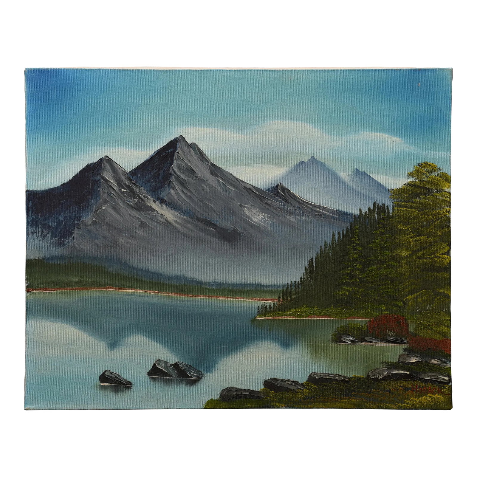 1980s Mountain Serenity Oil on Canvas by Hoback: This serene landscape painting by Hoback captures the beauty of a mountain lake nestled amidst a majestic range. The towering peaks, shrouded in mist, dominate the horizon, their rugged forms