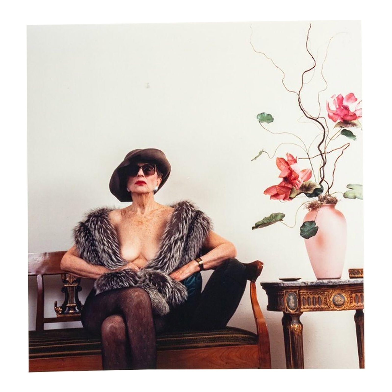 Anne Sager Seated Female Nude Photograph C-Print: Anne Sager (American, 1930-2024), Seated Female Nude, Color Photograph, Chromogenic Print, from the "Women Over 50" series, woman draped in fur stole, stamped "Anne Sager 19" to verso, unframed.