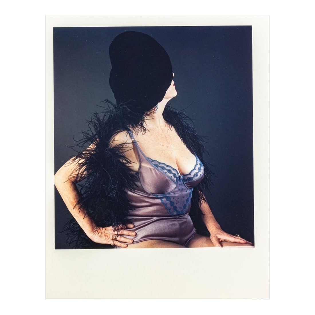 Anne Sager Seated Female Figure Photograph C-Print: Anne Sager (American, 1930-2024), Seated Female Figure, Color Photograph, Chromogenic Print, from the "Women Over 50" series, woman in lingerie with feather boa, stamped "Anne Sager 19" to verso,