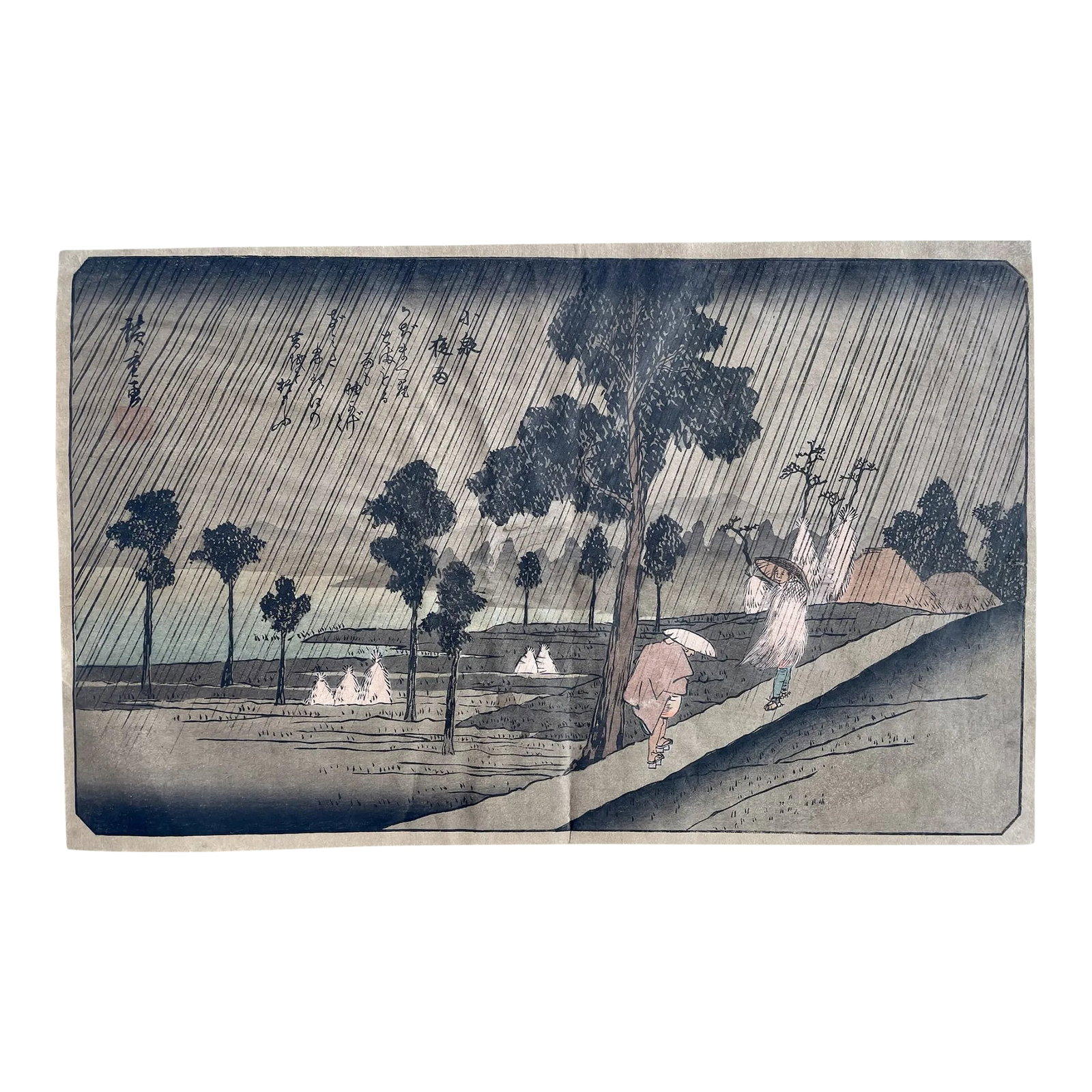 Night Rain at Kolzumi. An Early 19th Century Color Woodblock Print by Utagawa Hiroshige: A fine Japanese woodblock print on paper, by Utagawa Hiroshige entitled. Night Rain At Kolzumi. The piece is characteristically signed and stamped in the print. The print image features two figures