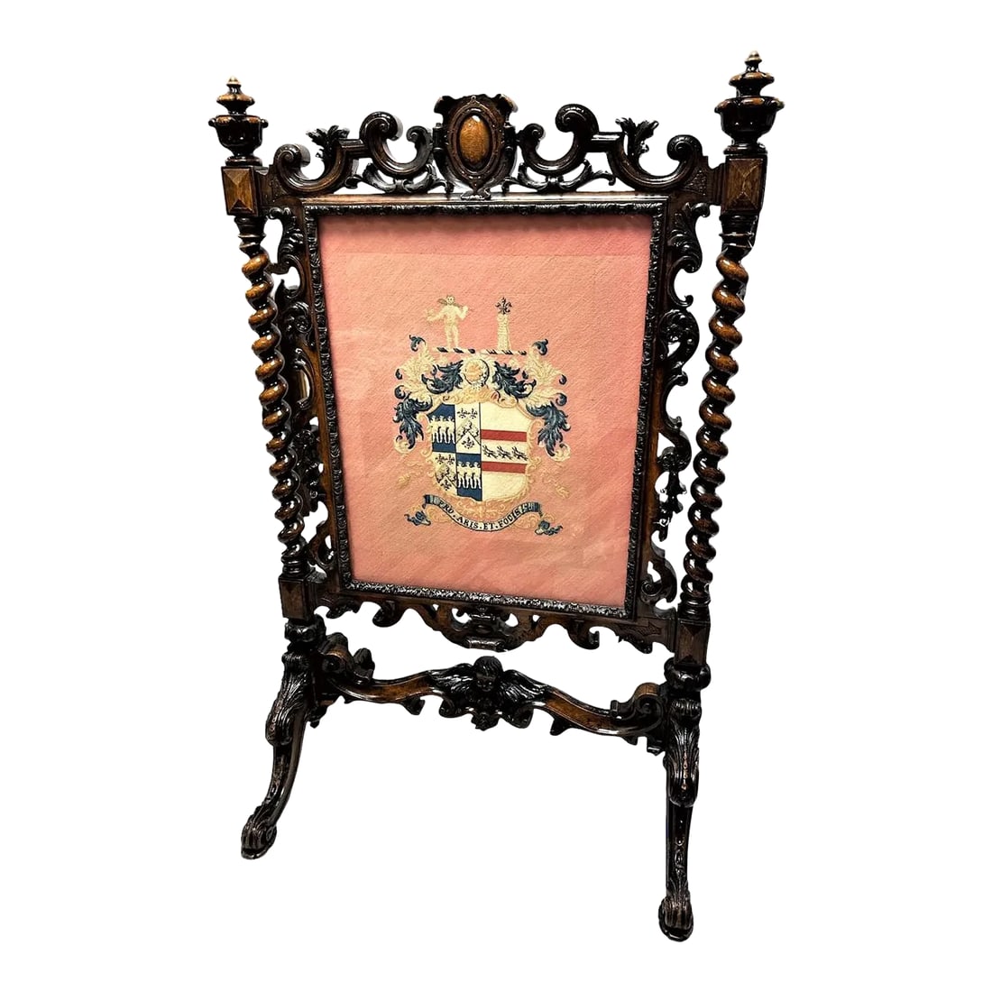 Antique Large Spanish Baroque Style Fire Screen in Carved Walnut and Needlepoint - Late 19th Century: Magnificent large Spanish Baroque Style fire screen, carved walnut on casters. Rose colored needlepoint with heraldic crest and motto "Pro Aris et Focis," Latin for "For Home and Hearth" or more