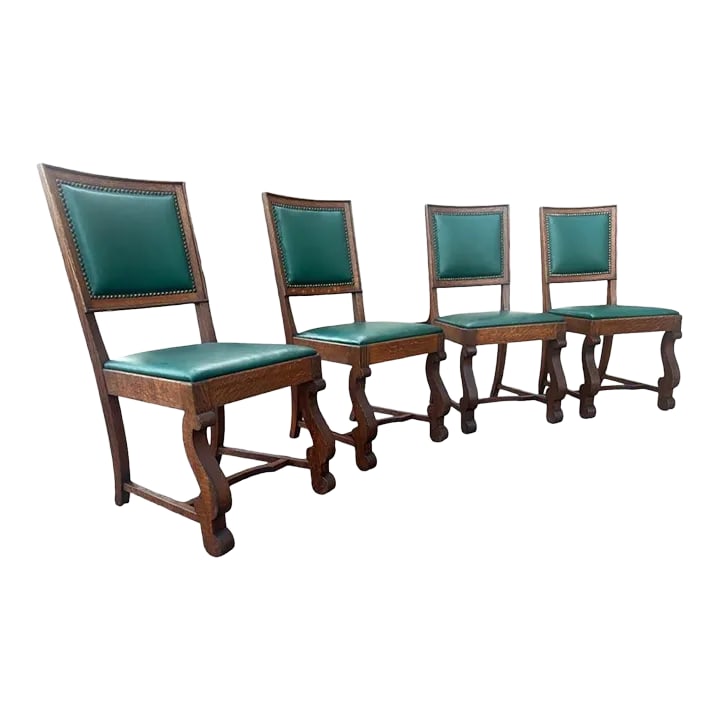 Antique Oak Hacienda Style Chairs - Set of 4: These chairs are remarkable in how they combine attributes of Spanish Colonial hacienda furniture (the legs) and the English Arts & Crafts movement (the top part of the chairs with their
