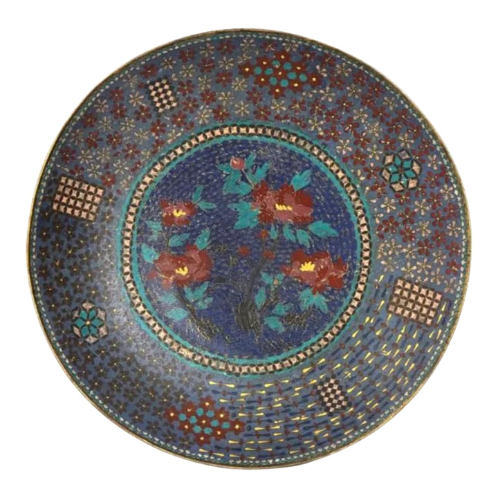 Large Antique Japanese Cloisonne Enamel Plate: A large rare antique, Meiji era, Japanese enamel over copper plate or charger. The interior of the plate is adorned with a polychrome enamel image of blossoming flowers surrounded by floral and