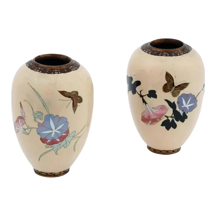 Late 19th Century A Pair of Barrel Shaped Japanese Meiji Cloisonne Enamel Butterfly Vases: An antique Japanese cloisonne enamel vase from the Meiji period featuring an elegant form with high shoulders and light beige ground color. Decorated with multicolor floral and foliate motifs with