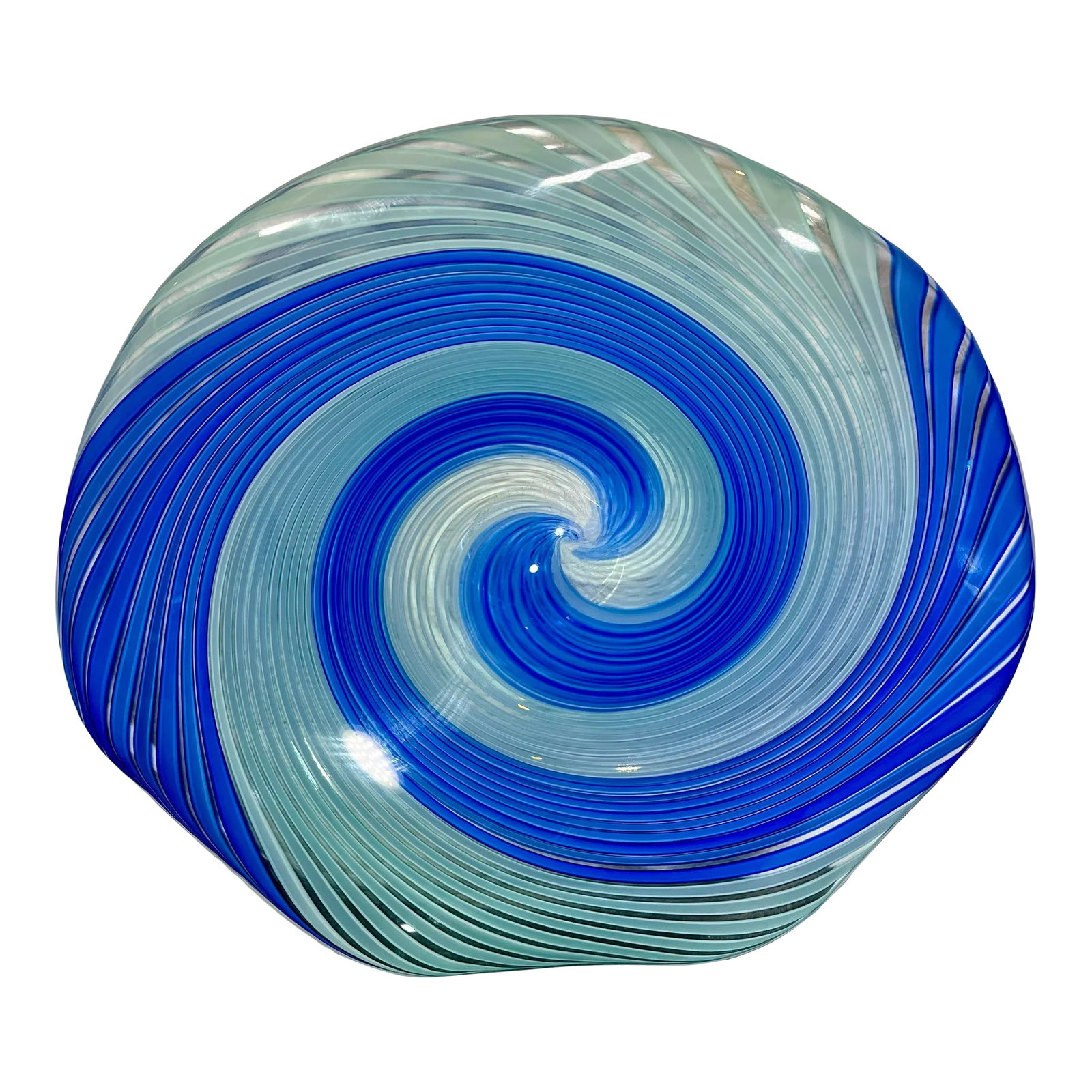 Mid 20th Century Murano Attributed Large Spiral Glass Bowl: Large & Heavy Murano Attributed Center Piece. Clear glass swirled with ribbons of blue and opaque blue. Bowl is elevated with a curved outer rim and a really cool trance like design. Condition: Altera