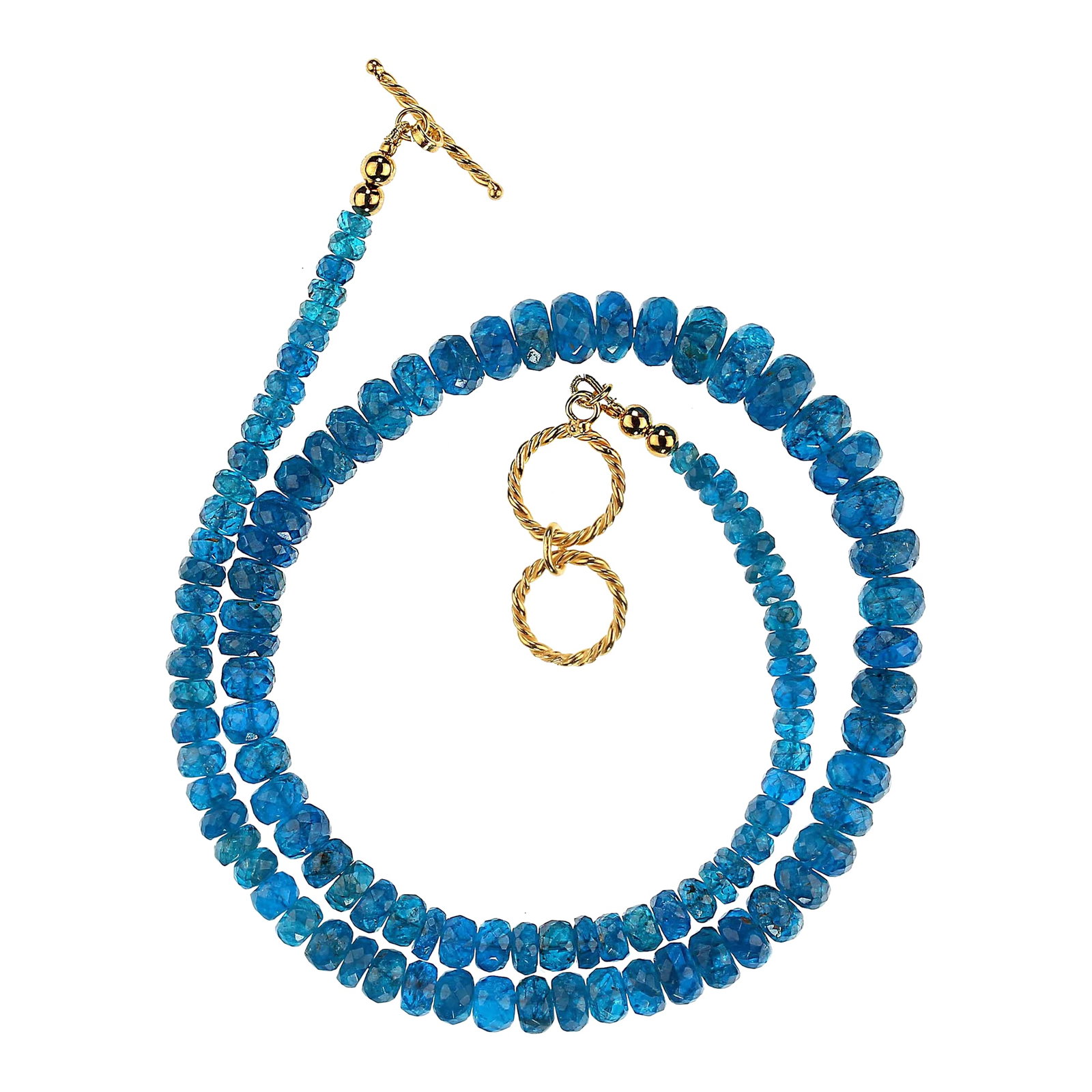 Graduated Rondelles of Neon Apatite Necklace: This is part of Chairish's Costume Jewelry assortment. Stunning 19-Inch Neon Apatite Necklace – A Unique Glow Illuminate your jewelry collection with this breathtaking 19-inch neon apatite