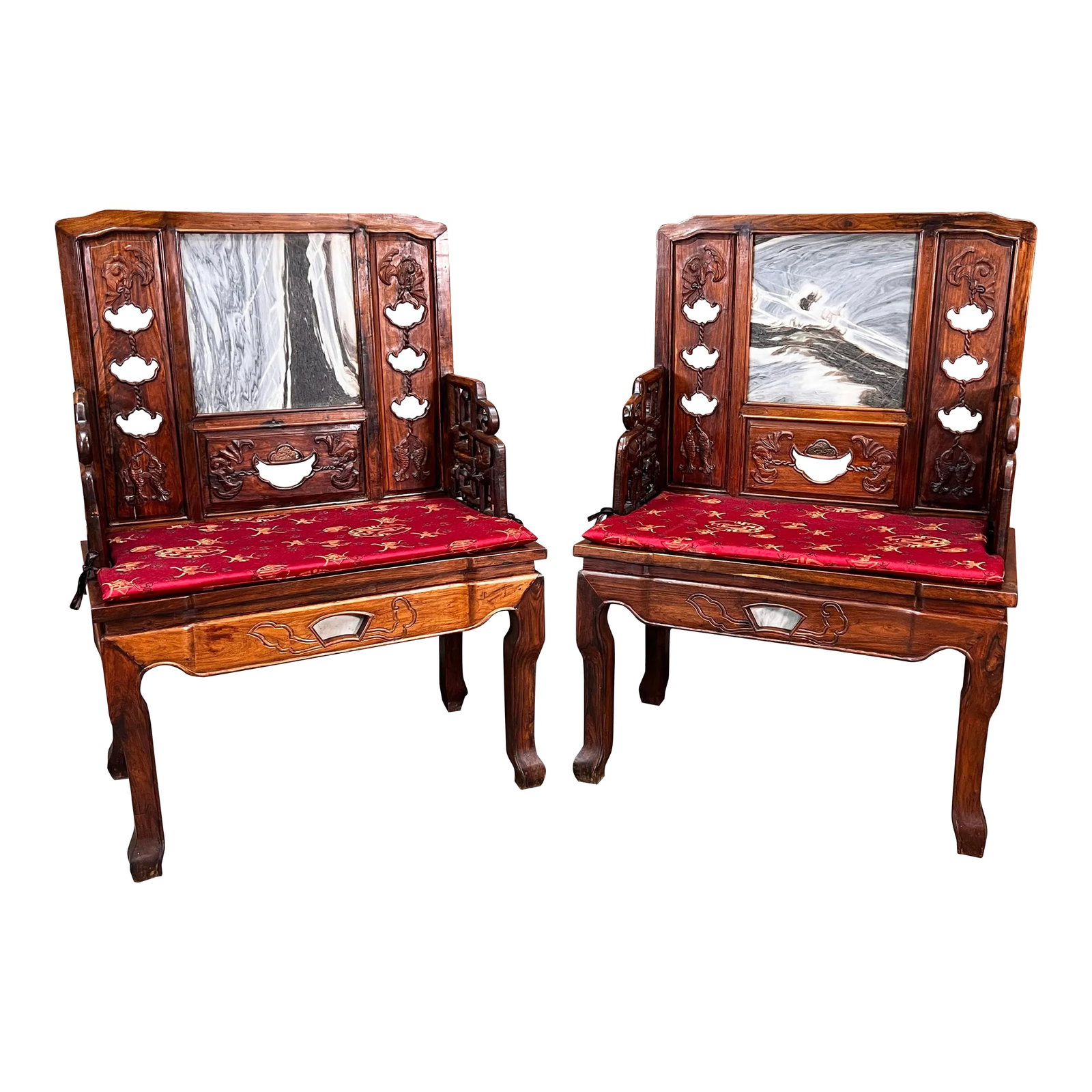 Vintage Carved Chinese Rosewood Arm Chairs With Inset Stone Backs - a Pair: This pair of vintage c.1940's/50's Chinese rosewood armchairs features unique hand carved details and marble stone inset backs, showcasing unique natural patterns. The chairs come with red cushioned