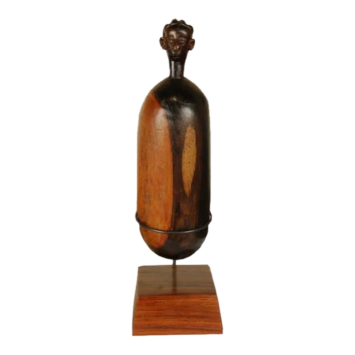 Antique African Namji Fertility Figure: Doted on like an actual child, this carved doll was once owned by a young girl among the Namji people of northwest Cameroon. Carted around by its owner wherever she went and lovingly adorned with
