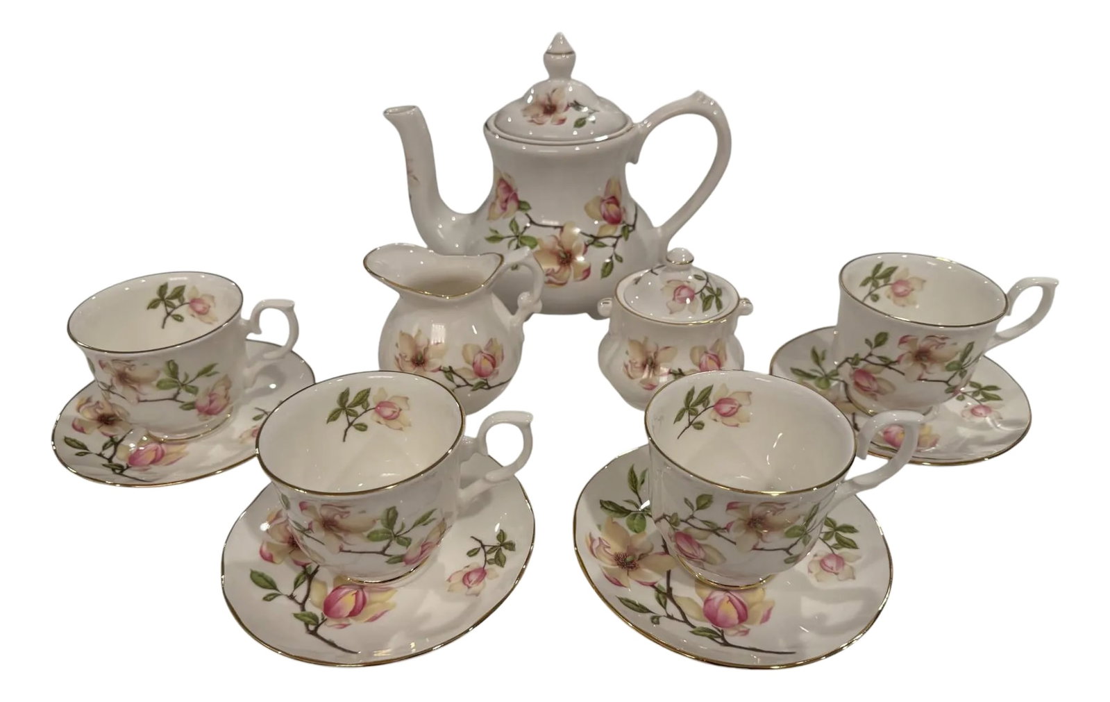 Mid 20th Century Fine English China Staffordshire Collection Tea Set- 11 Pieces: Quick Hits: Made in England by Staffordshire potteries Mid-20th century fine bone china tea set Features delicate rose motif with gilt edging 11-piece set including teapot, creamer, sugar, and cups