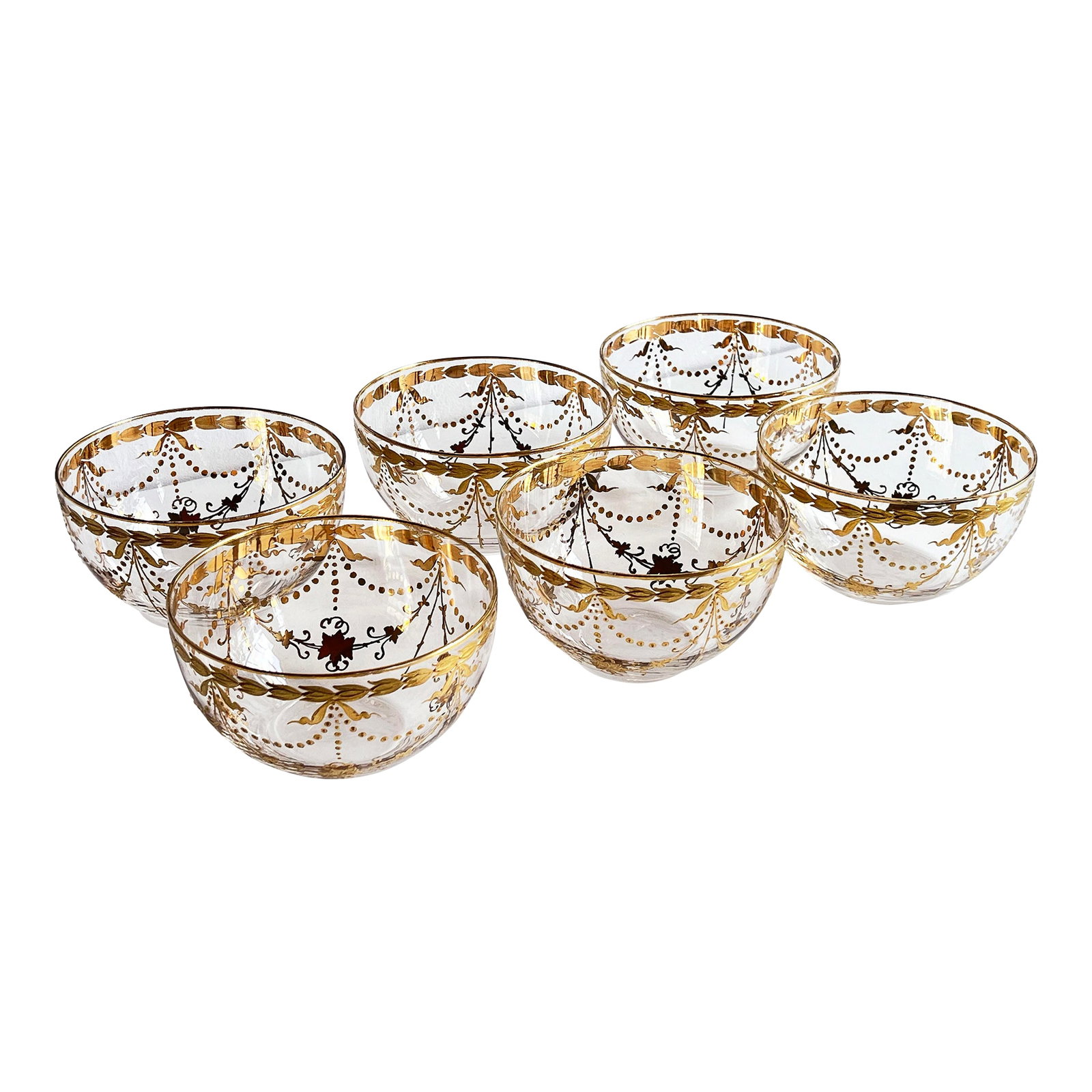 Antique Bohemian Gilt Glass Dessert Bowls With Draped Garland Motif - Set of 6: This exquisite set of six hand-blown Bohemian dessert bowls features intricate gilt decoration with neoclassical garland and tassel motifs draped between leafy swags. The gold embellishment is