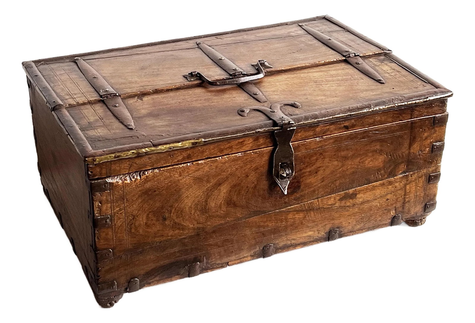 Antique 18th C. Indian Teak 18" Dowry Chest / Box With Iron Strapping and Brass Detailing: A beautifully aged late 18th century Indian dowry chest crafted from solid teak hardwood with hand-forged iron strapping and brass accents. The piece features beautiful joinery, a hinged lid with iron