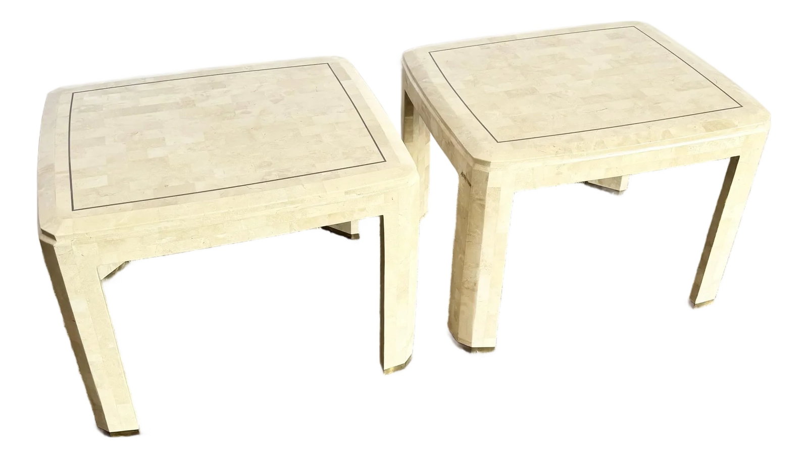 Postmodern Polished Tessellated Stone Side Tables With Brass Inlay - A Pair: A sculptural pair of postmodern side tables crafted in polished tessellated stone with refined brass inlay. These striking pieces showcase sleek waterfall silhouettes and a mosaic-like surface that gl