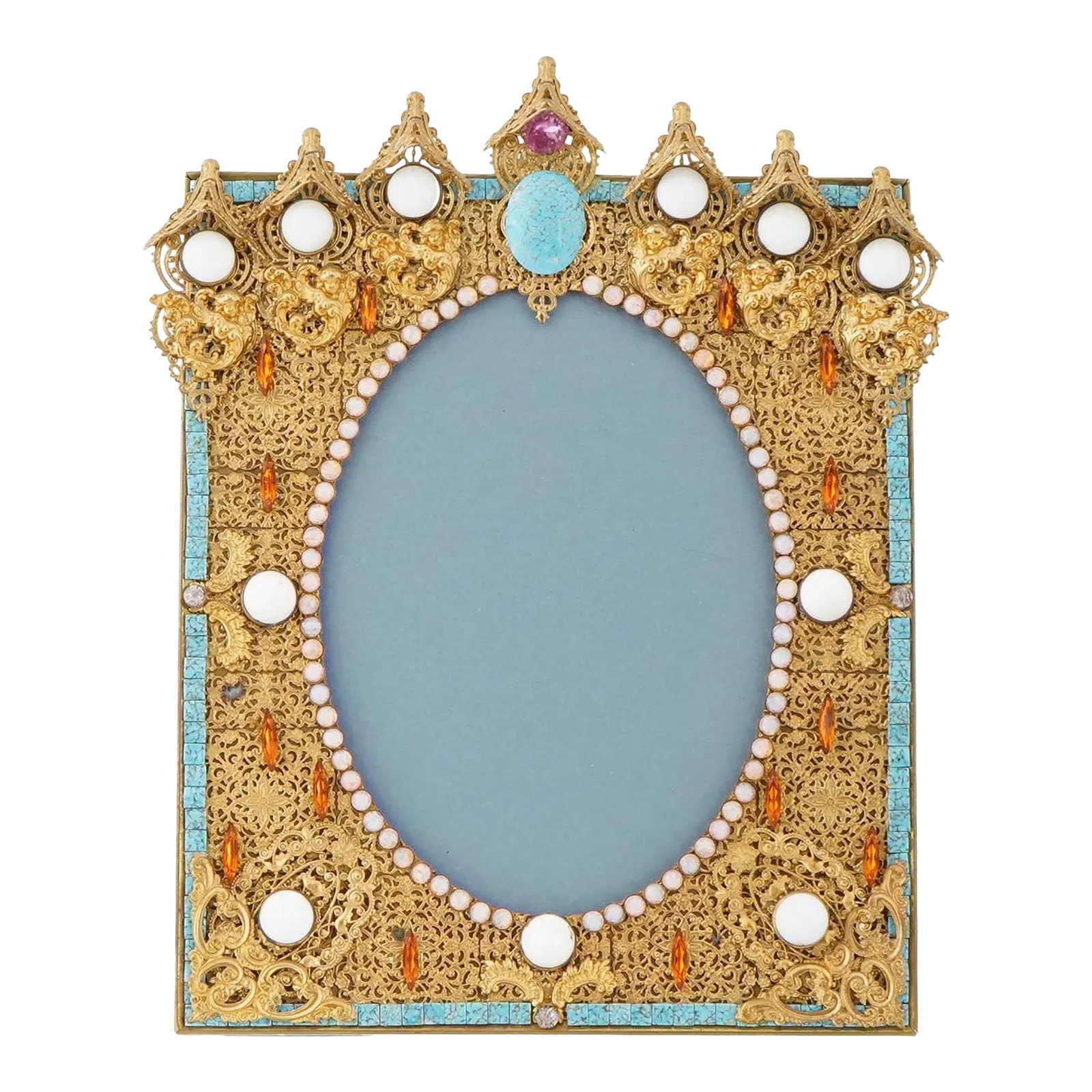 19th Century Relief Design Gilded Brass Picture Frame Marked: A vintage gilded brass picture frame. The frame features a relief design, adorned with decorative elements that include colorful stones and pearls, set against the gold tone background. The ware is
