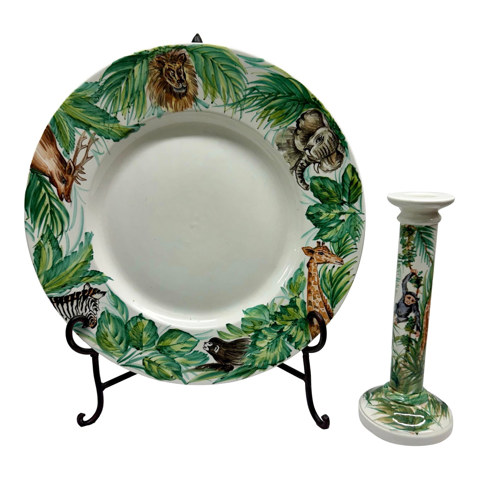 Late 20th Century Oggetti Safari Plate & Candlestick: Bring a touch of jungle glamour to your table with this hand-painted Oggetti Safari decorative plate and candlestick holder set, crafted in Italy by Greg M. Matthews. Vivid jungle animal and leaf