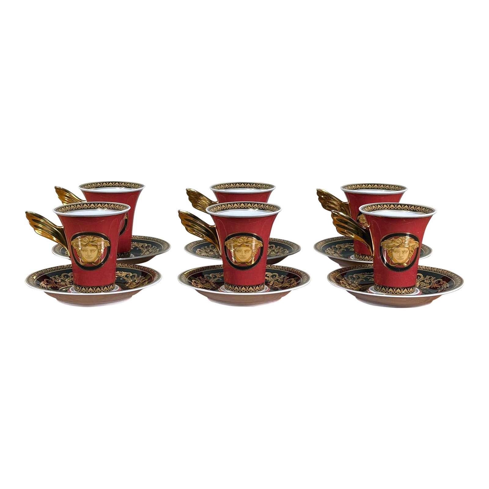 Baroque Versace Medusa Red Espresso Cups and Saucers - Set of 6: A dramatic and luxurious set of six espresso cups and saucers from the Rosenthal x Versace collaboration, featuring the iconic Medusa head in rich gold on vibrant red porcelain. Designed in the