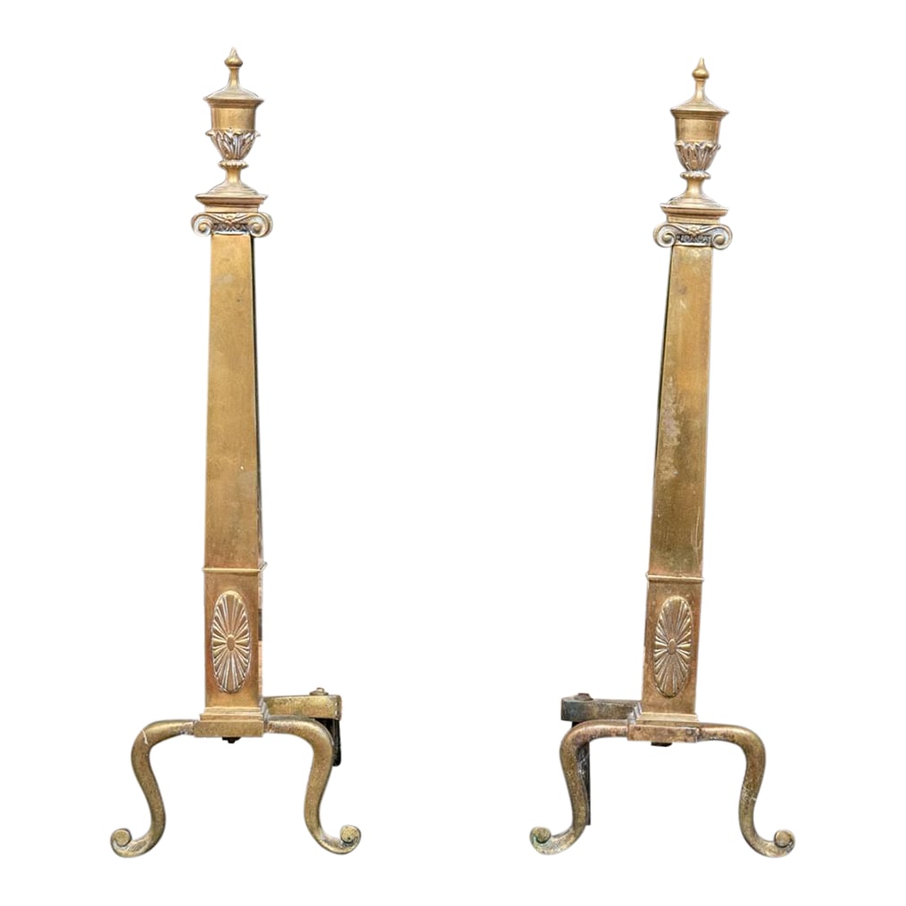 A Wonderful Collection of Antique Brass Fireplace Accessories: Antique Brass Fireplace Tools A wonderful collection of antique brass fireplace accessories including a pair of French Empire style andirons with urn finials over tapered square columns with oval flor