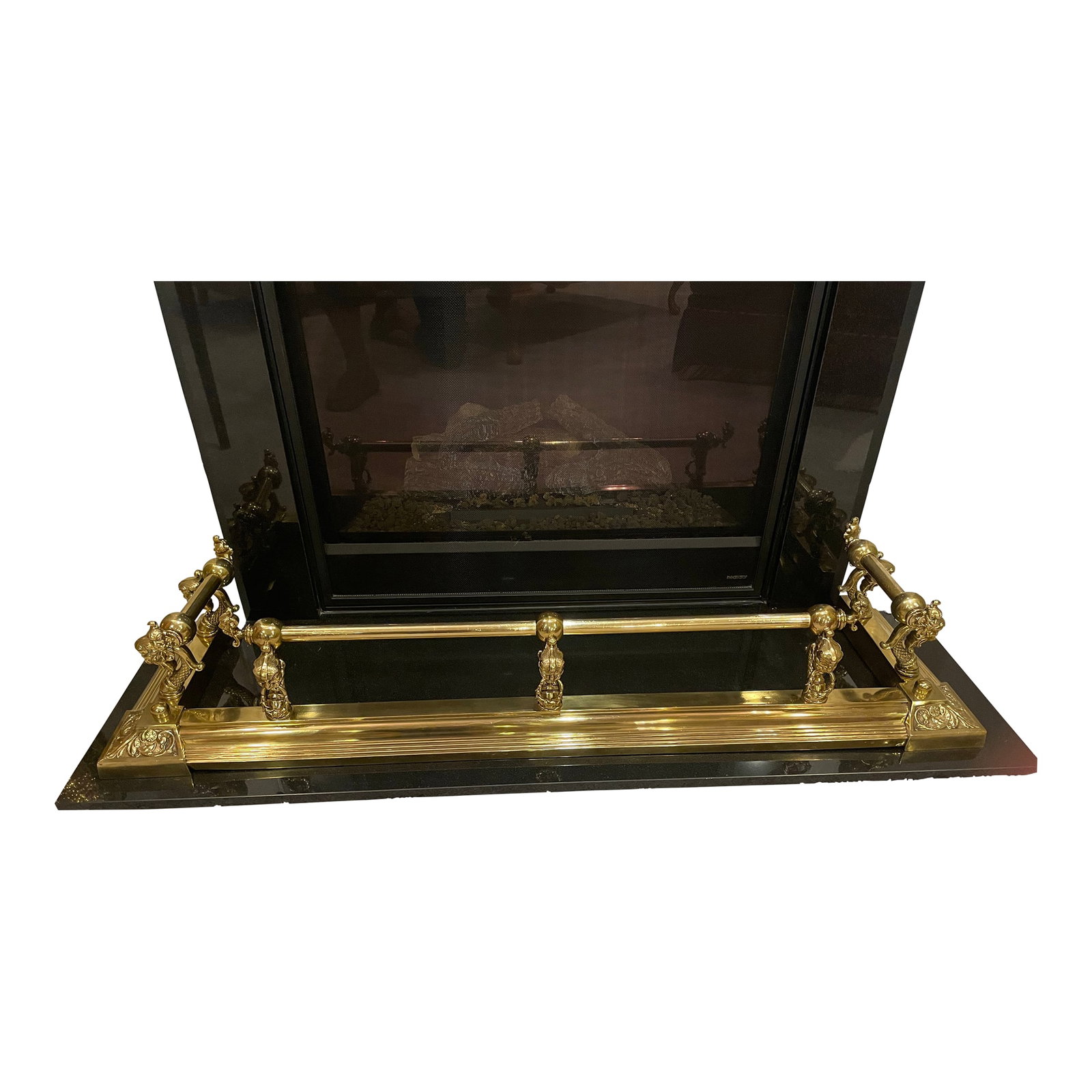 Antique Brass Fireplace Fender: Antique ornate fireplace fender featuring seven large gargoyle like heads with long necks and six small gargoyle like heads. Condition: Alterations: Original Condition Unaltered Imperfections: Some