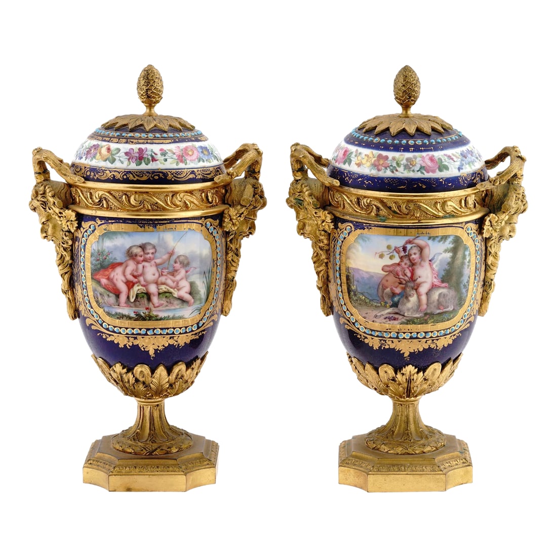 1880s French Sevres Style Blue Ormolu Porcelain Urns-Pair: Bring the grandeur of 19th-century French decorative arts into your collection with this pair of circa 1880s Sèvres-style porcelain urns, richly mounted in gilded ormolu bronze. Though unmarked,
