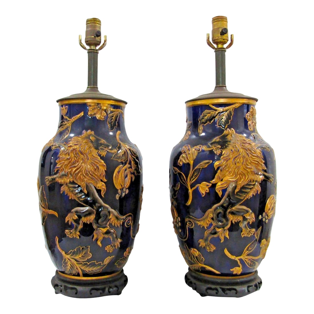 Late 19th Century Keller & Guerin French Porcelain Vase With Lion Rampant Table Lamps - a Pair: This is a pair of antique French porcelain polychrome faience vases with a lion rampant design, served as table lamps. They are medium in size, featuring a blue and gold color scheme. The vases are