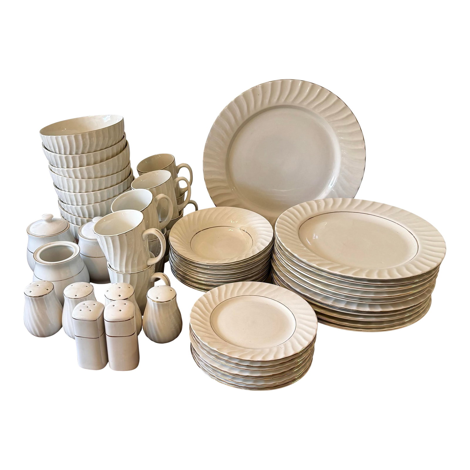 1960s Totally Today Dinnerware - 52 Piece: This elegant collection is characterized by its pristine white color and distinctive swirled patterns radiating from the center of each plate, accented with a subtle gold rim. This set includes a