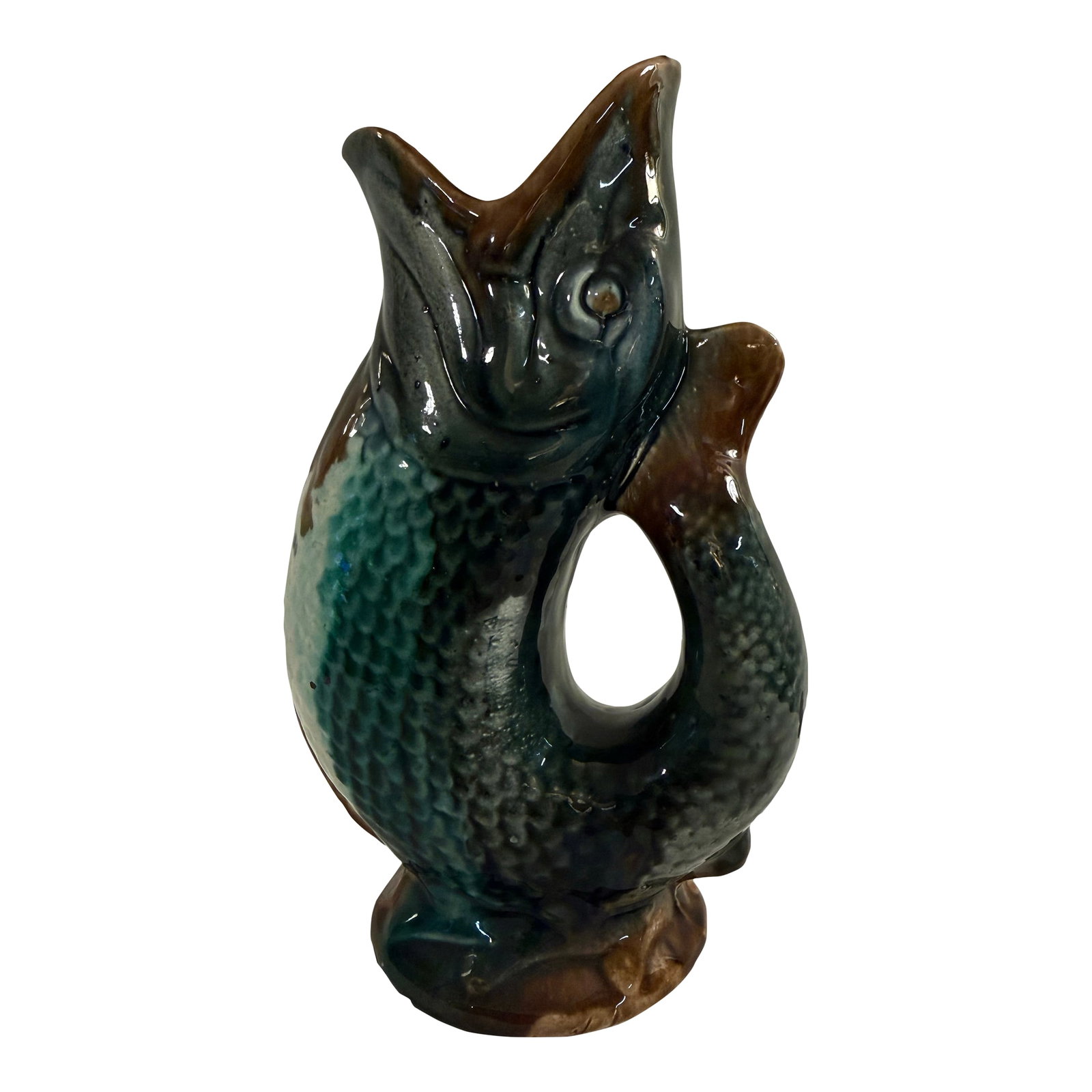 Early 20th Century Majolica Gurgling Fish Antique Pitcher: A stunning gurgling fish pitcher. Beautiful majolica fish form pitcher, teaturing dramatic color palette of greens and browns. Most likely an English piece. Measures approximately 10 inches tall, 6