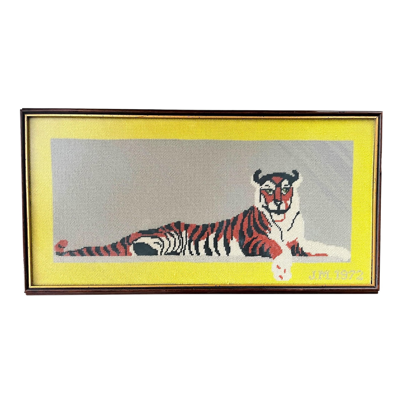 Large 1972 Framed Princeton Tiger Needlepoint on Gray Field With Yellow Border Initialed by Maker: A wonderfully graphic and distinctly collegiate hand-stitched needlepoint depicting a reclining tiger, signed and dated "JML 1972." From the estate of a Princeton professor. Rendered in bold