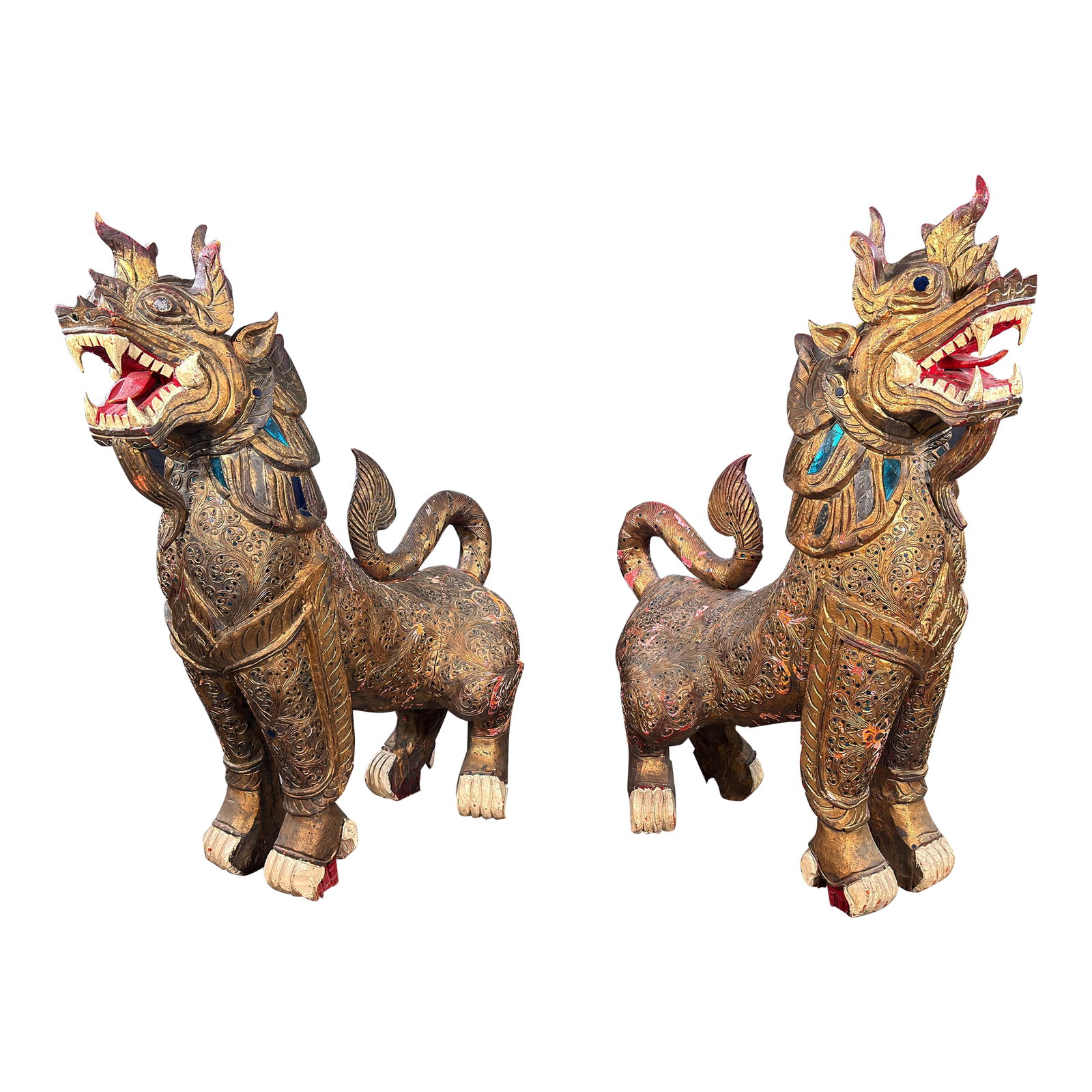 Antique c.1920's/30's Pair of Monumental Burmese Carved Wood Gilt Temple Guardian Lions / Foo Dogs: These monumental Burmese Chinthe, the mythological lion-guardians traditionally placed at temple entrances, are exceptional in scale and in the density of their surface carving. Every inch of the hand