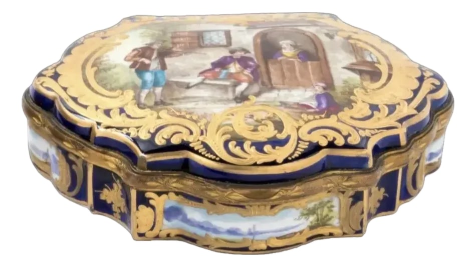 1840 Sevres Louis XVI Blue Gold Porcelain Box - 1 Pc: A beautiful 19th-century French Sèvres porcelain box, dating to circa 1840 and richly decorated in royal blue with hand-painted scenic detail, gilt ornamentation, and a floral fabric-lined