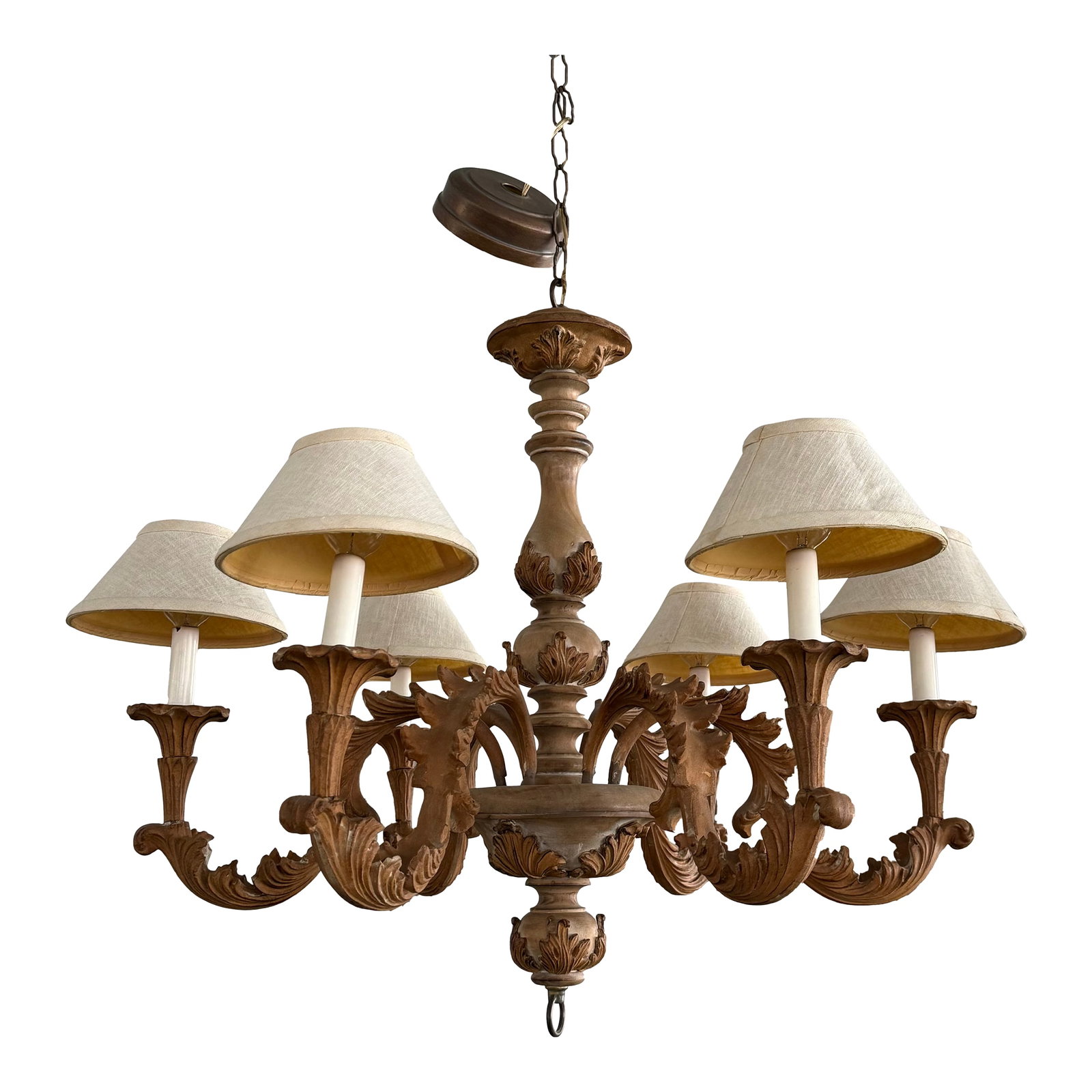 Late 20th Century Italian Baroque Style Carved Wood 6-Arm Chandelier: This late 20th century Italian Baroque style chandelier features a 30" diameter carved wood body with six arms. The dynamic carvings are adorned with sweeping scrolls, intricate foliate motifs and