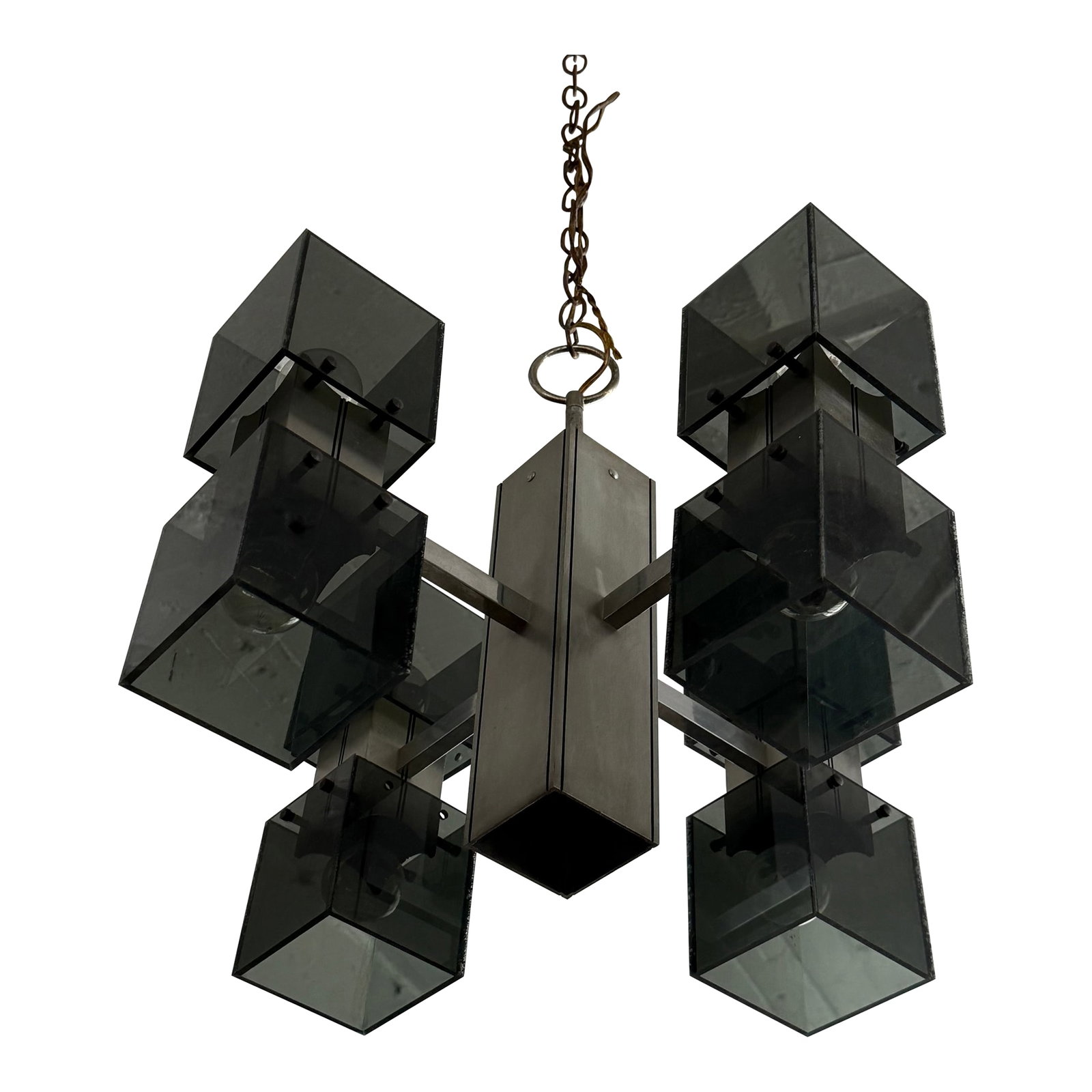 Late 20th Century Brutalist Smoked Plexiglass "Ice Cube" Chrome Chandelier: This striking Mid-Century Modern chandelier features a bold architectural silhouette defined by a central chrome pillar supporting a series of smoked plexiglass cubes. Capturing the essence of 1970s