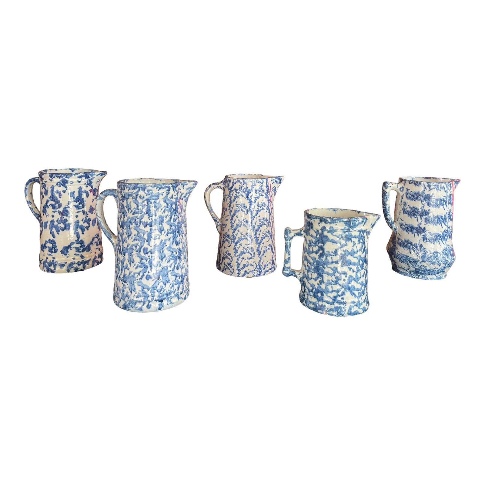 Set of Five Antique English Spongeware C. 1870-1890: Exceptional set of five English spongeware pitchers from an esteemed California collection. Spongeware is a type of pottery decorated by dabbing paint or colored slip onto a ceramic surface using a na