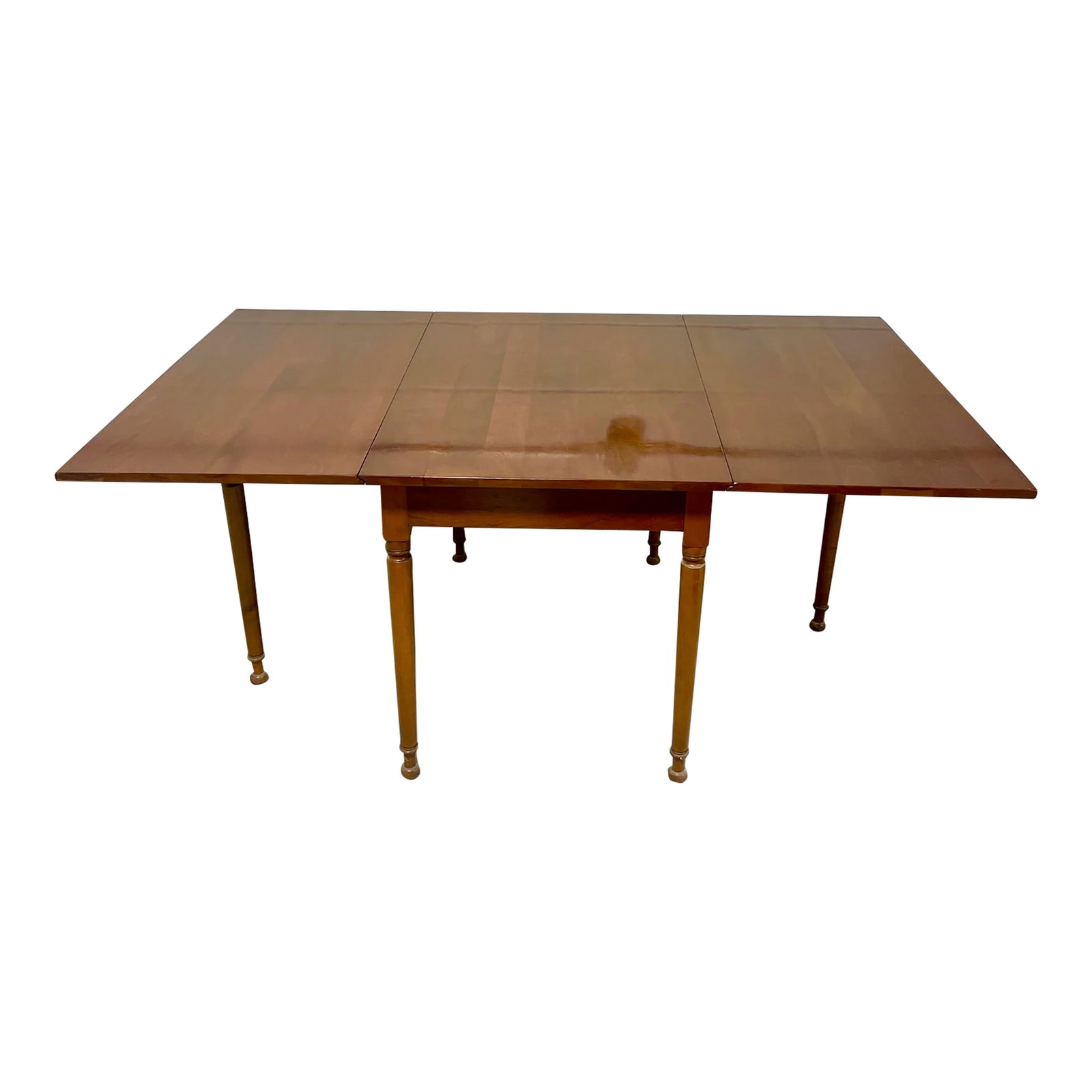 1953 Stickley Cherry Drop-Leaf Table: This Stickley Furniture Company cherry drop-leaf table is dated on the label 1953. This table features a cherry plank top of exceptional color and figuring. And it showcases Stickley's outstanding com