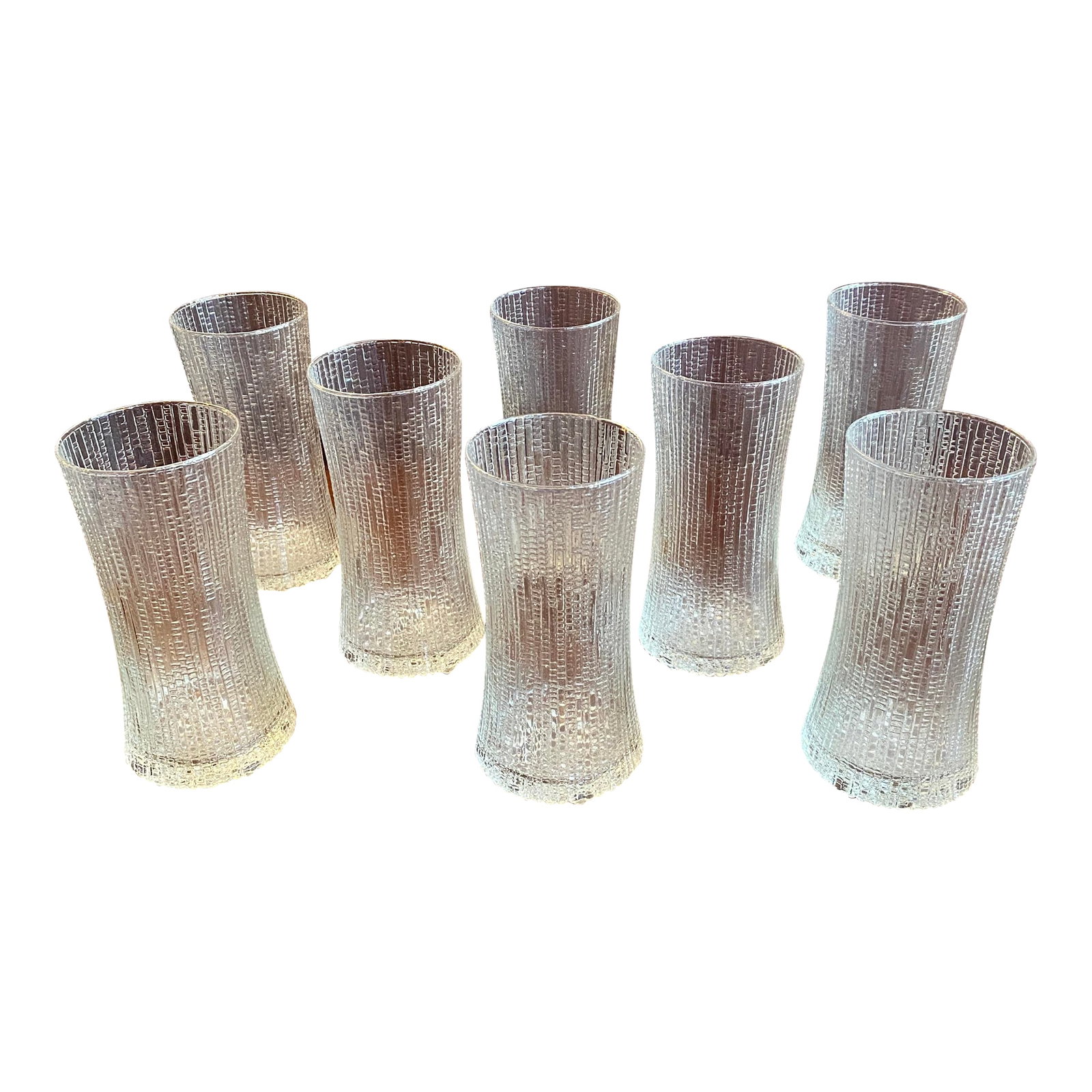 Mid 20th Century Mid-Century Iittala "Ultima Thule" Drinking Glasses by Tapio Wirkkala - Set of 8: This set of eight vintage drinking glasses features the iconic "Ultima Thule" pattern designed by Tapio Wirkkala for Iittala in 1968. Inspired by the melting ice of Lapland, the Scandinavian